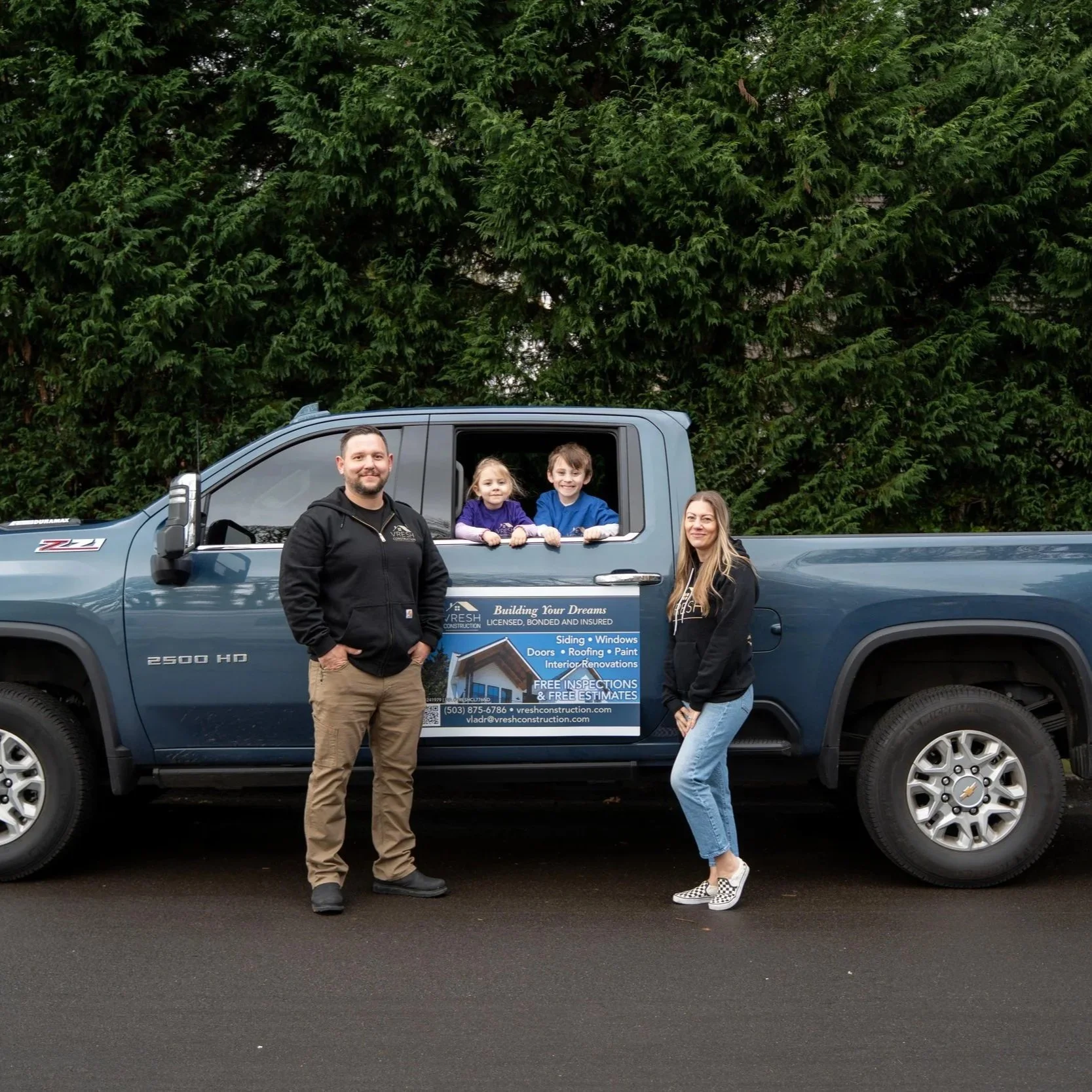 Contractors beside work truck, symbolizing home inspection and importance of identifying soft wood early to prevent costly dry rot damage in exterior structures.