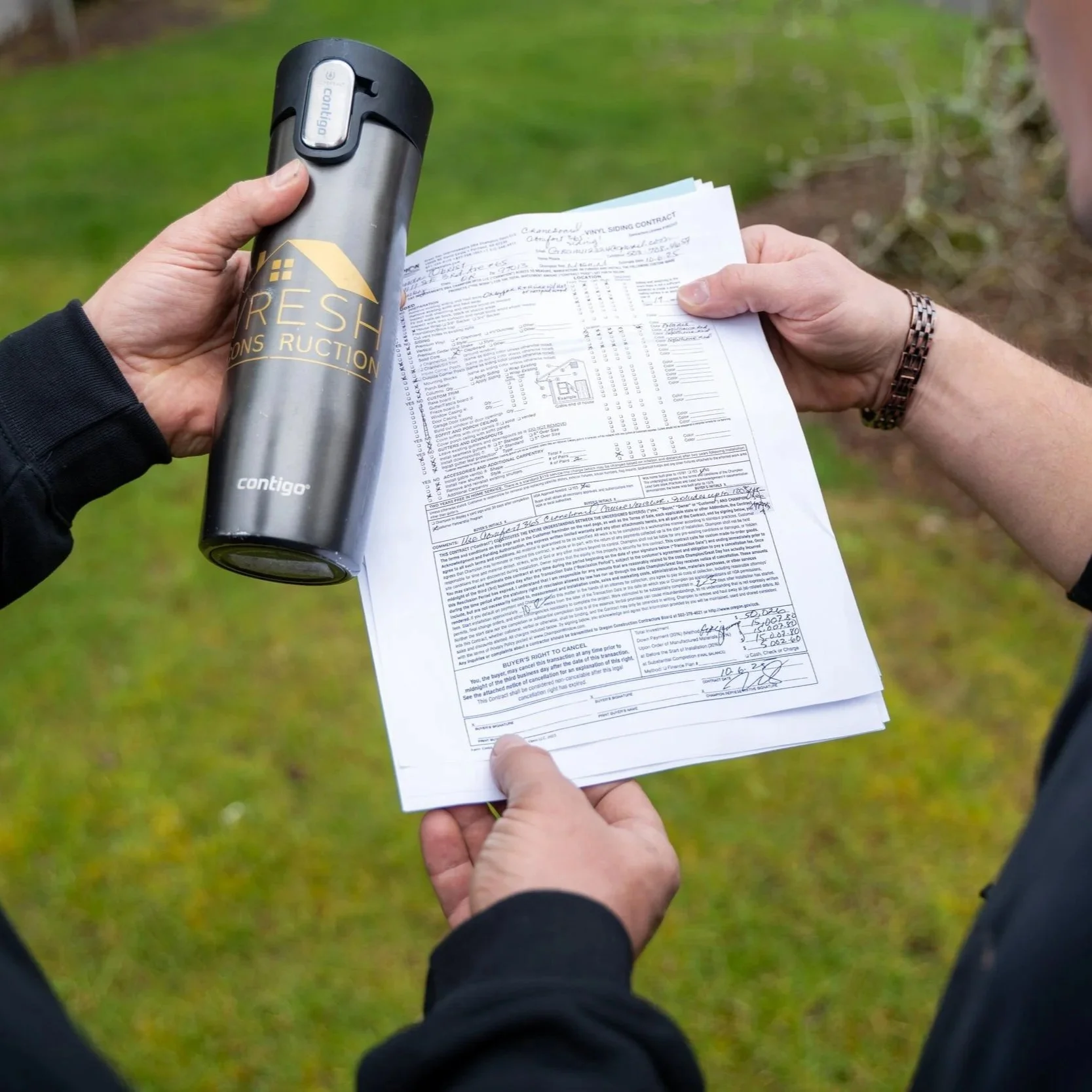 Contractor holding documents and equipment outdoors, representing planning and installation of patio covers to protect decks from moisture and extend durability in rainy climates.