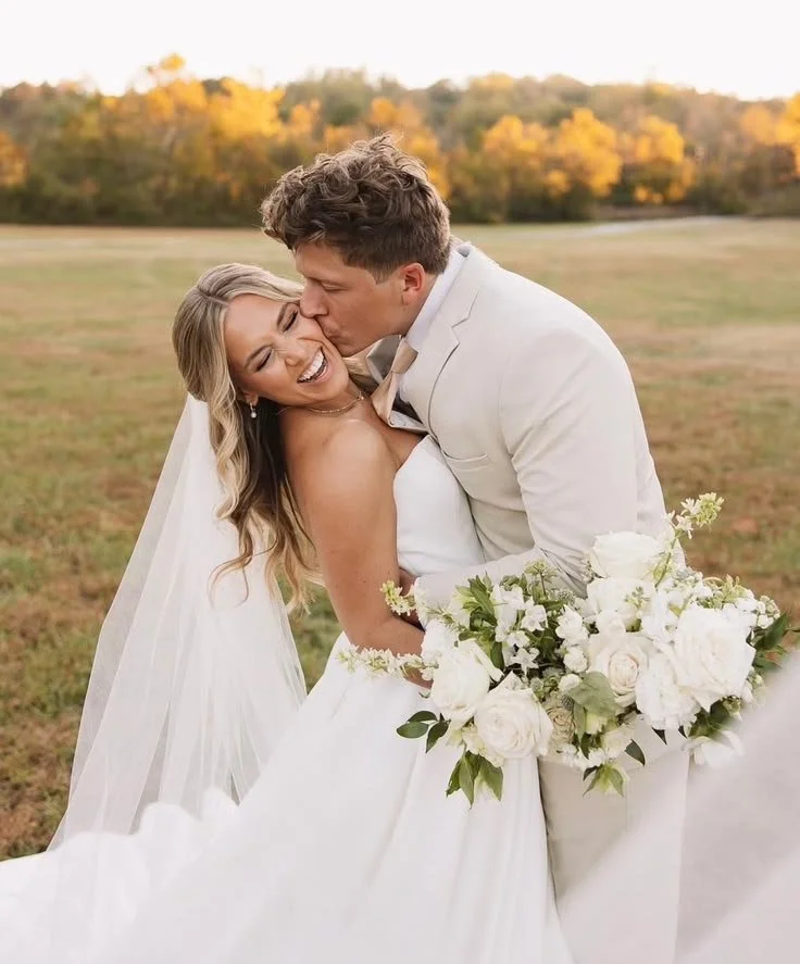 Happy couple, wedding photos by Montgomery County wedding photographer with bride and groom smiling outdoors.