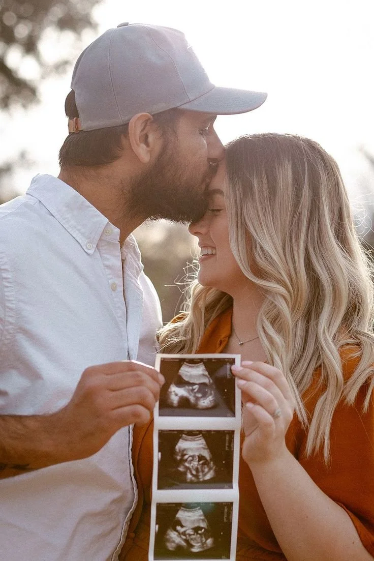 Maternity photos, pregnancy announcement, image of expecting couple captured by family, lifestyle, and maternity photographer in Tomball, Texas.