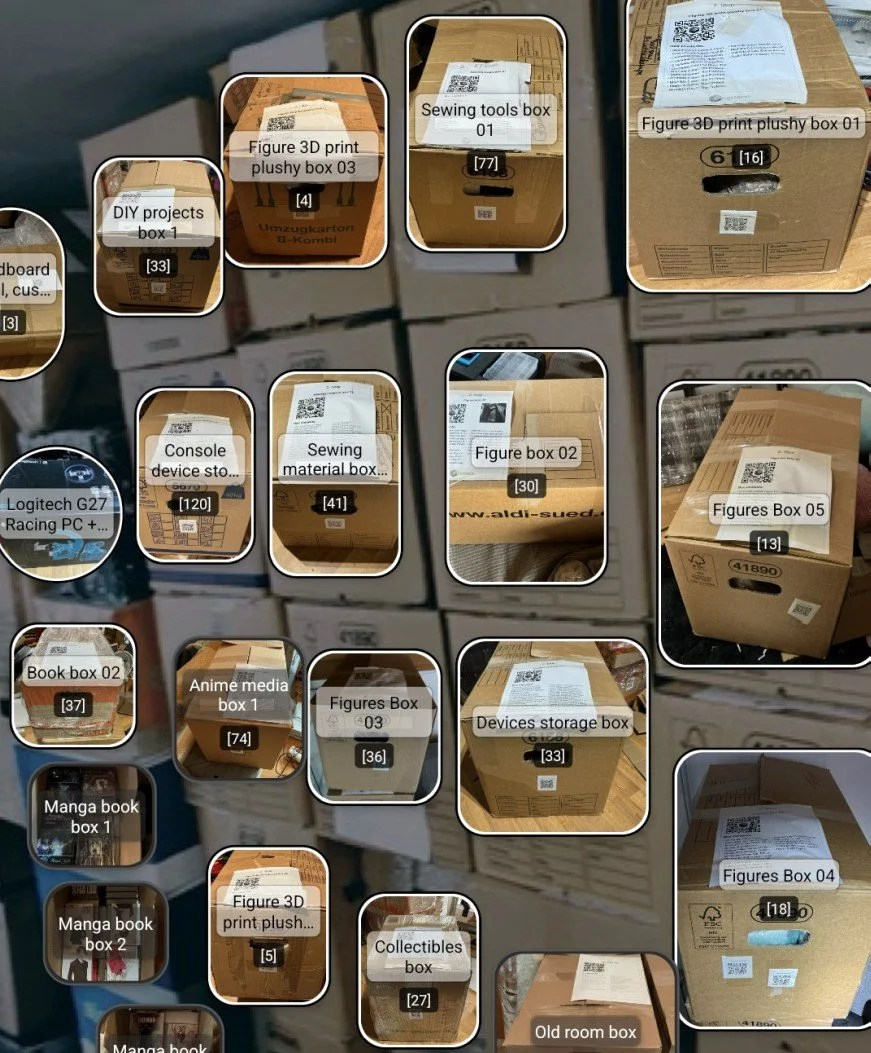 Several cardboard boxes stacked on shelves, labeled with various contents including DIY projects, sewing tools, 3D print plushy figures, game consoles, sewing materials, figure boxes, anime media, manga books, collectibles, old room items, and devices storage, each with descriptive labels.