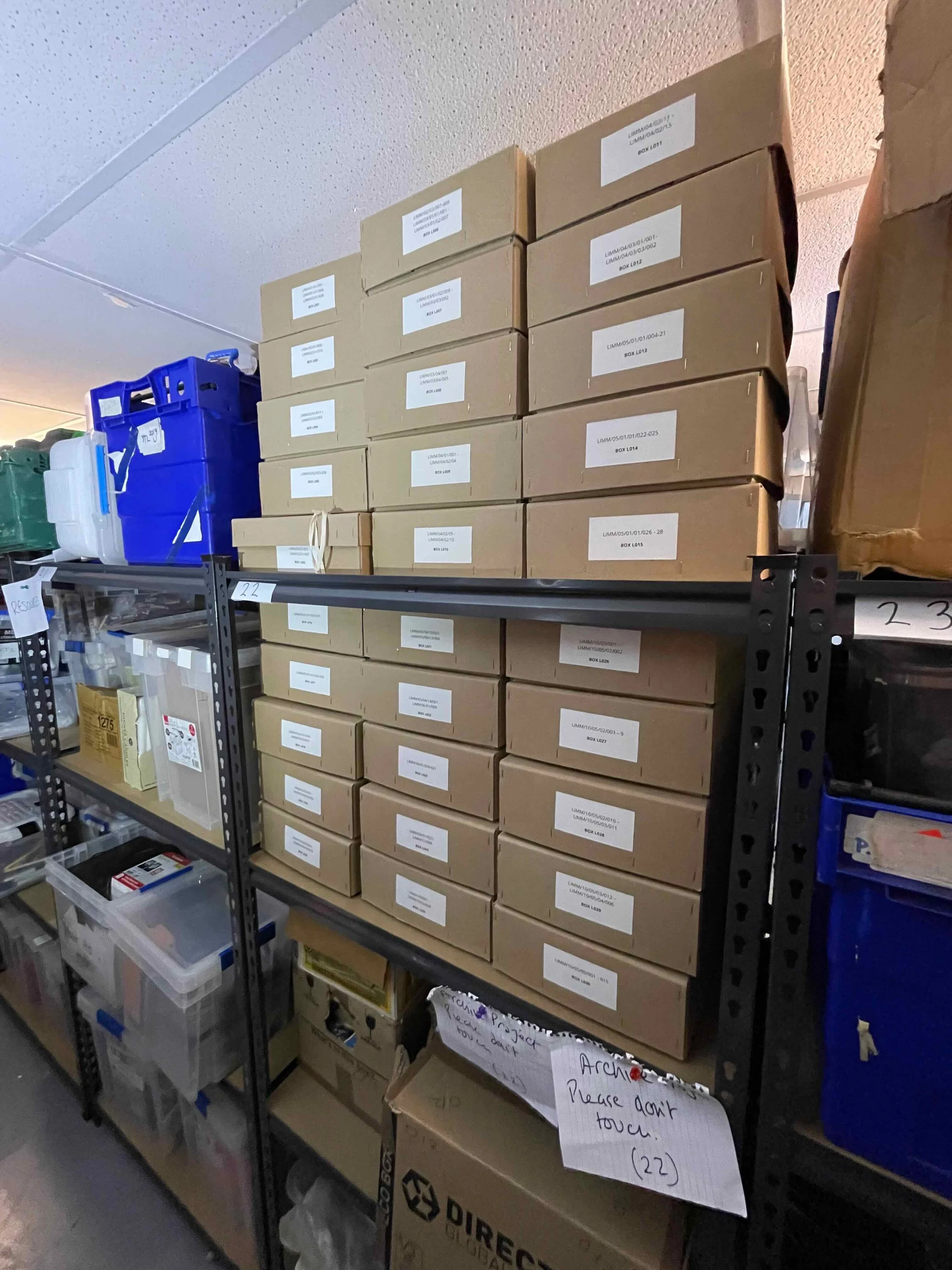 Where disorganised records were once stored, now the records are listed and housed in boxes ready for permanent retention in a suitable archive facility.