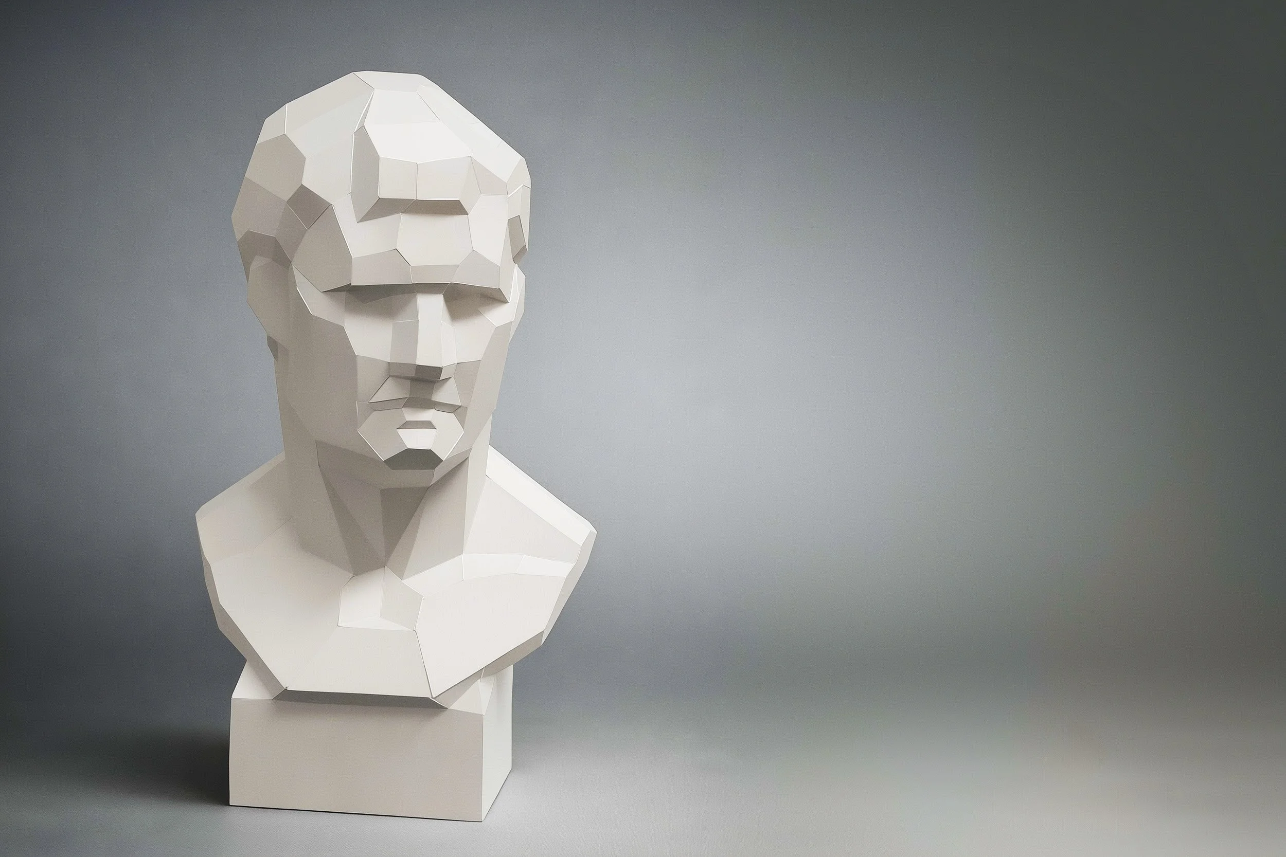 Technical view of the LUMISCA Agrippa paper sculpture, highlighting the precision of its low-poly structure and mathematical facets against a minimal grey background.