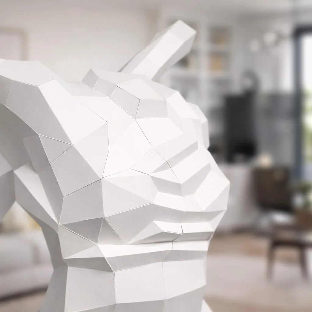 A close-up view of the LUMISCA Nike paper sculpture, revealing the razor-sharp edges and geometric complexity that represent over 30 years of 3D modeling mastery.