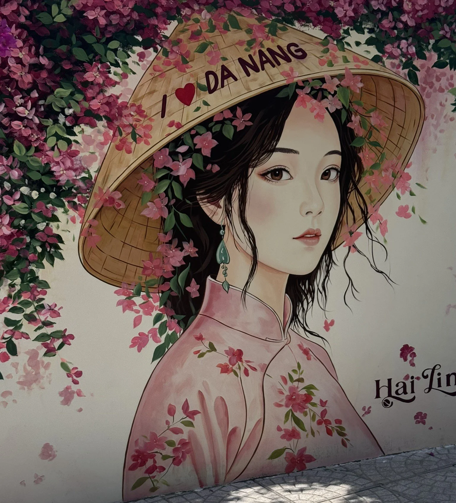 Painting of woman with I love Da Nang Conical Hat