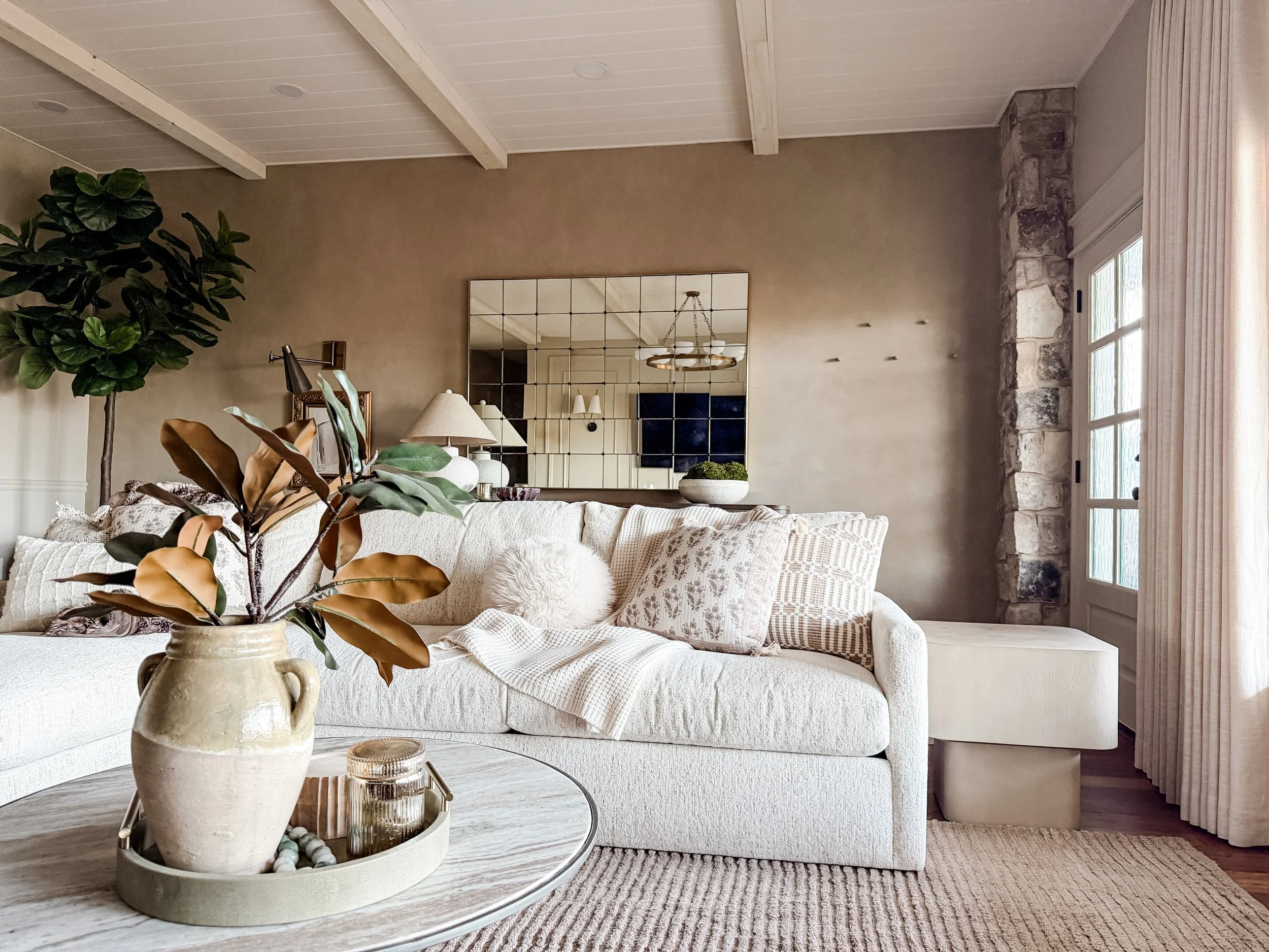 Neutral living room with layered textures and natural materials, designed by Studio Meadow in Alpharetta, Georgia