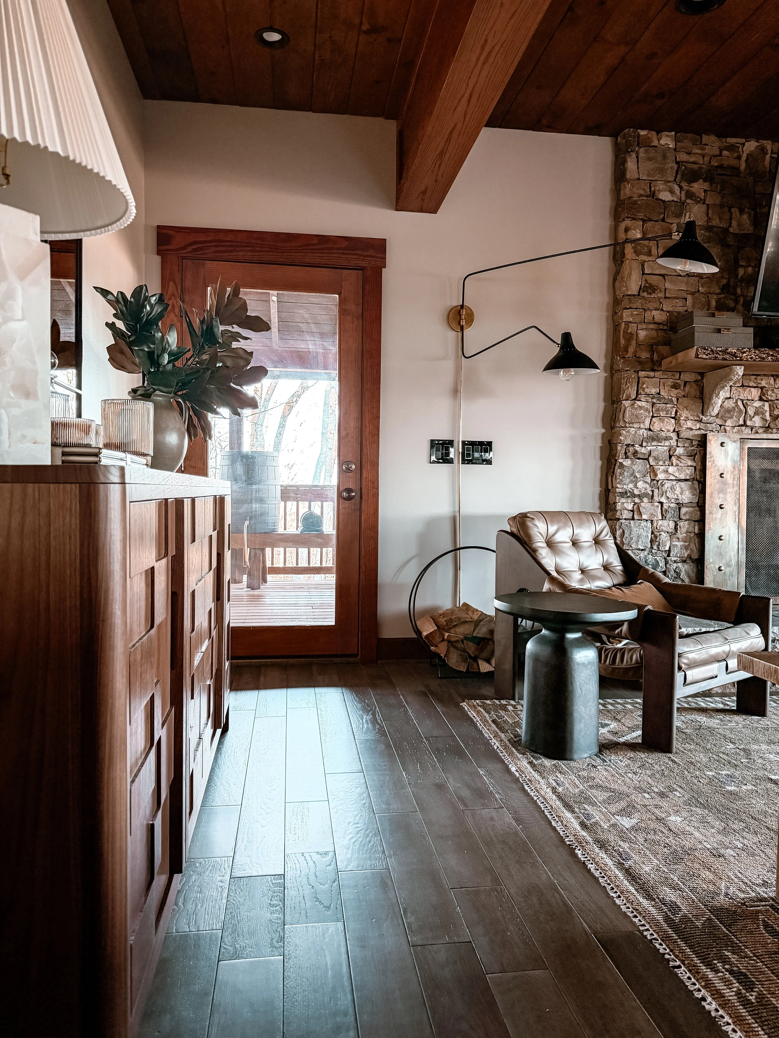Custom walnut bar with handcrafted doors in a luxury living room designed by Studio Meadow