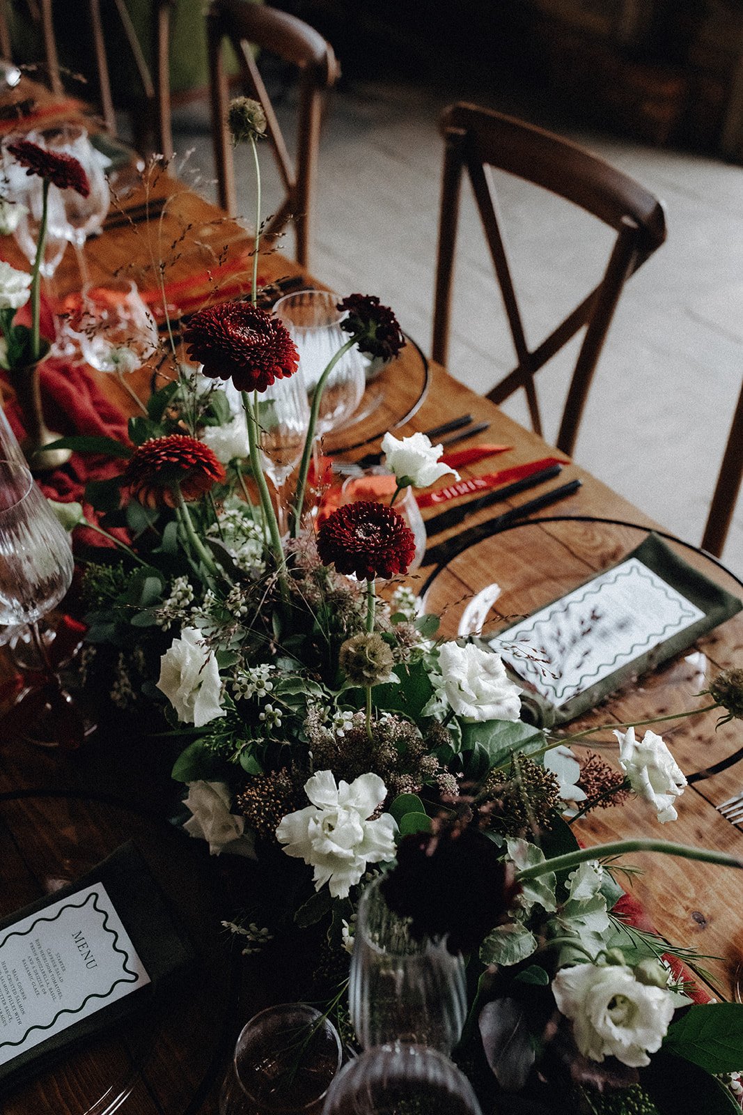 moody-blooms-wedding-table-flowers-dark-red-dahlia-centrepiece.jpg