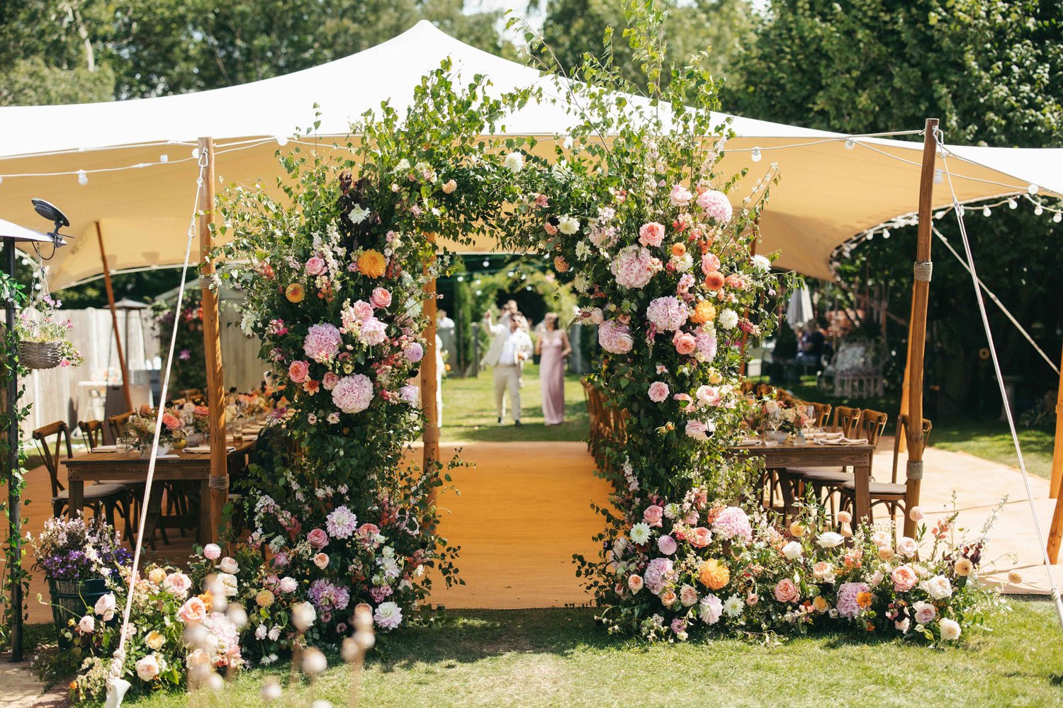 moody-blooms-kent-wedding-florist-ceremony-floral-arch-outdoor.jpg