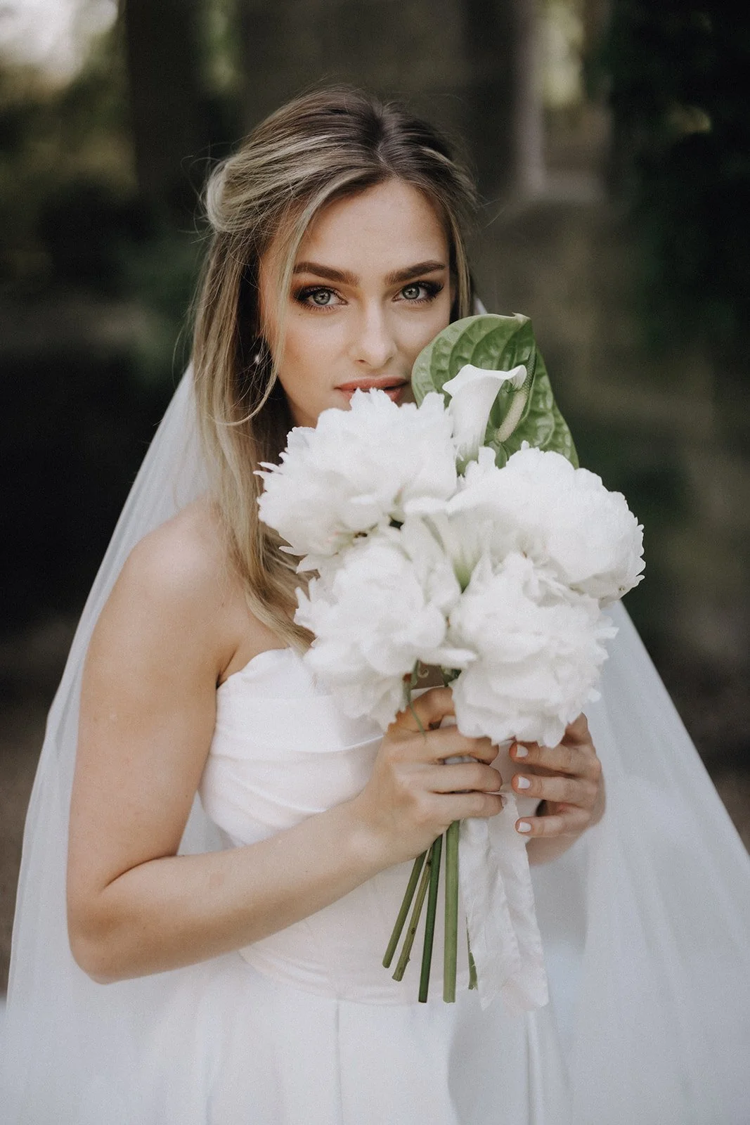moody-blooms-wedding-bouquet-white-peonies-bride-anthurium.jpg