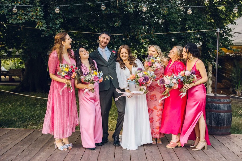 moody-blooms-wedding-florist-bridal-party-pink-dresses-bouquets.jpg