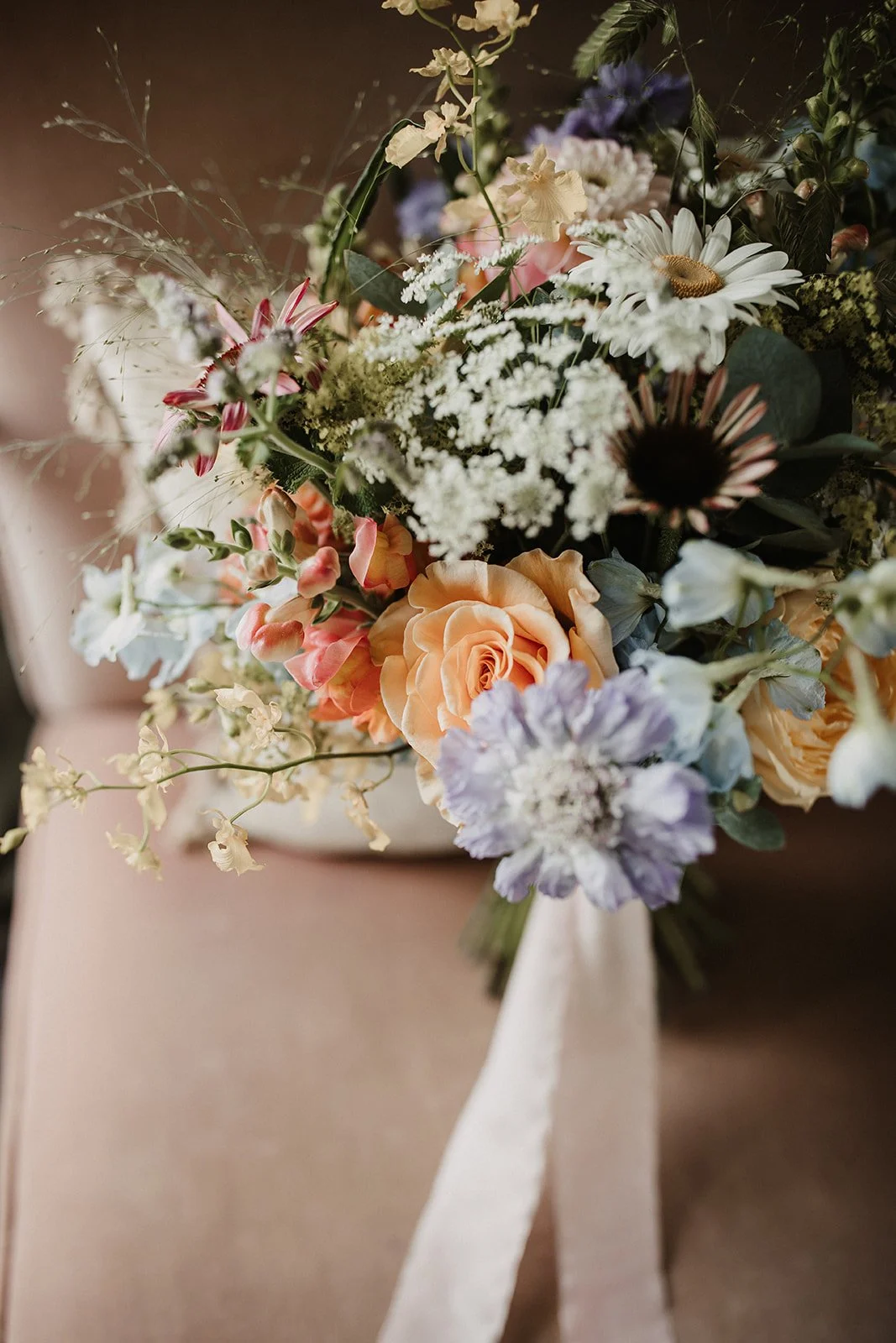 moody-blooms-wedding-flowers-loose-wildflower-bouquet-orange-rose.jpg