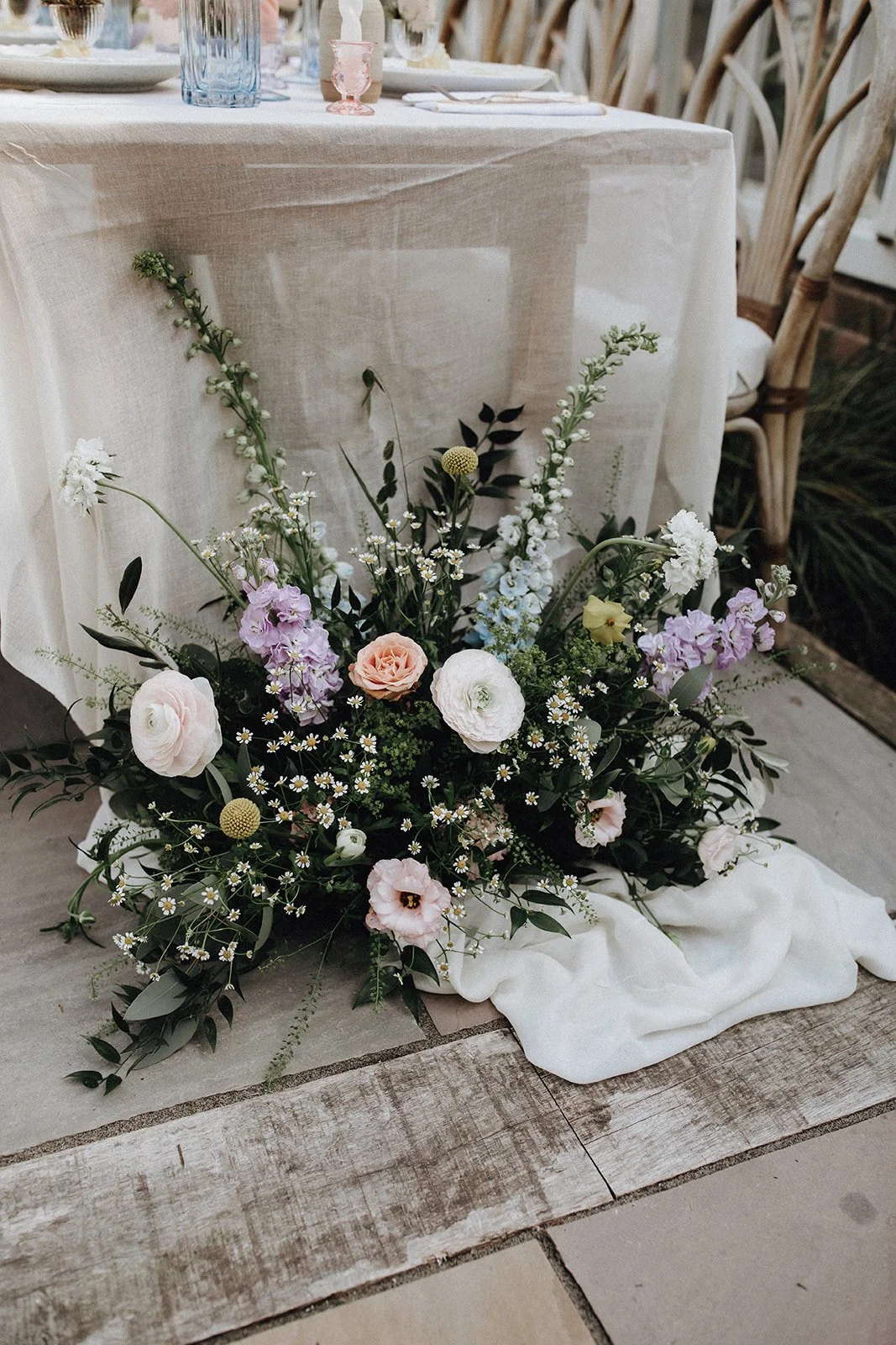 moody-blooms-wedding-sweetheart-table-floor-flowers-pastel-floral.jpg