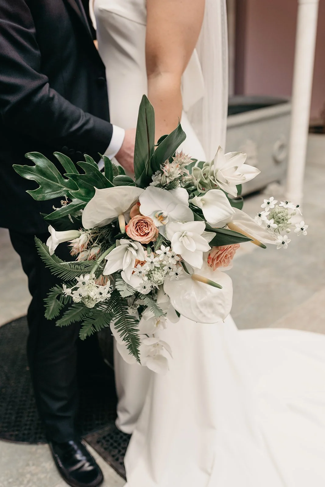 Luxury wedding bouquet with white orchid anthurium tropical flowers