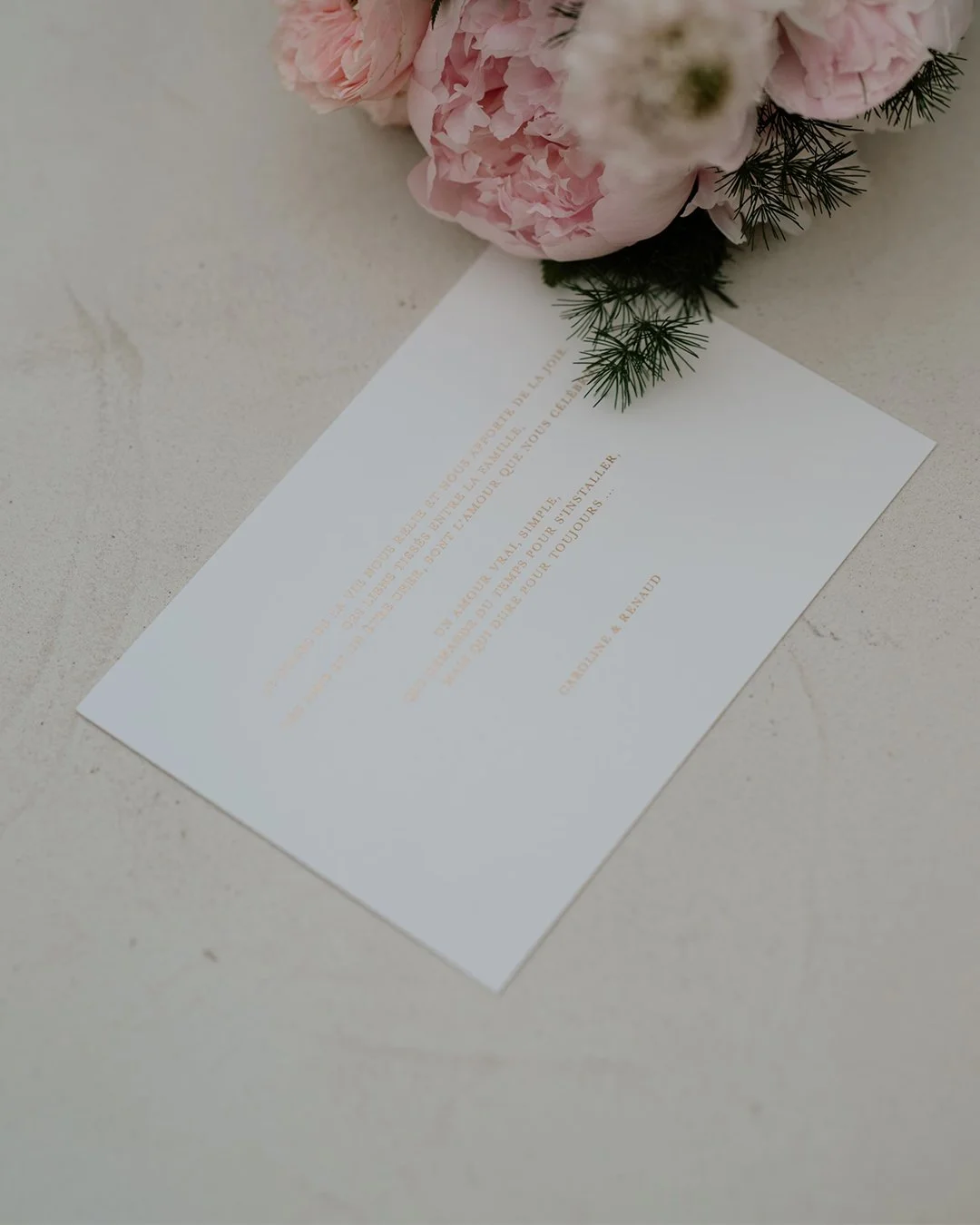 Refined gold foil detail on minimalist celebration stationery