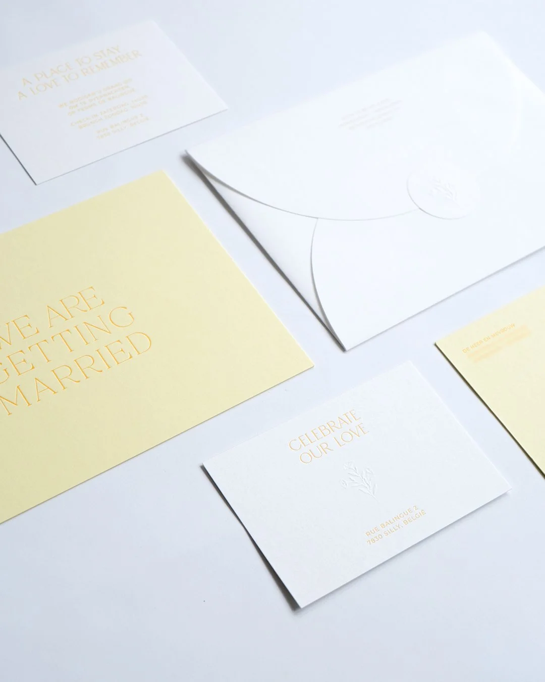 Letterpress wedding invitation with blind embossed flower detail