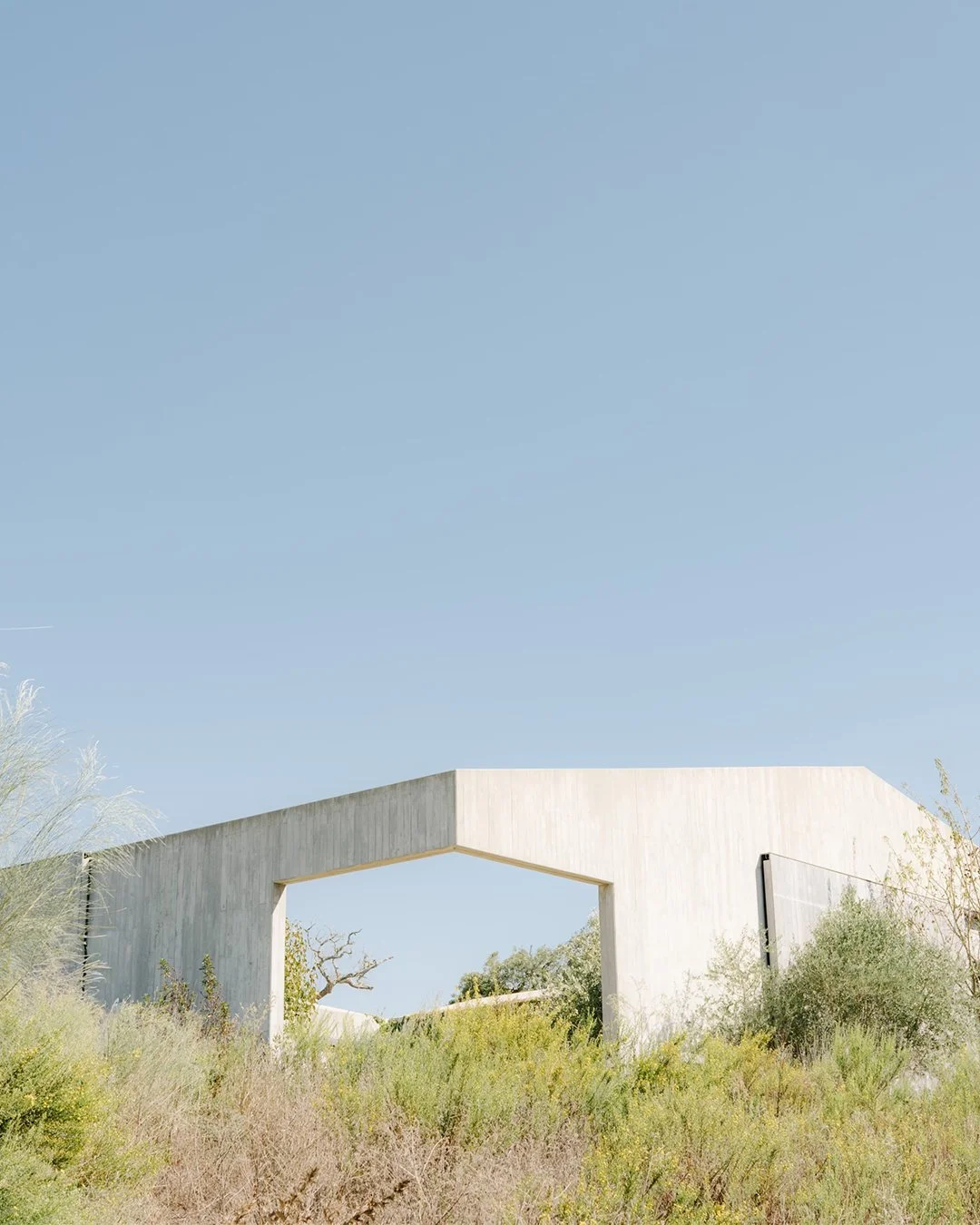 Architectural wedding stationery suite with folded elements and minimalist design.