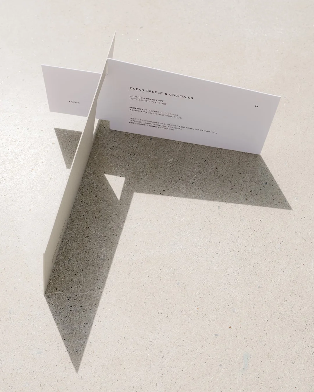 Architectural wedding stationery suite with folded elements and minimalist design.