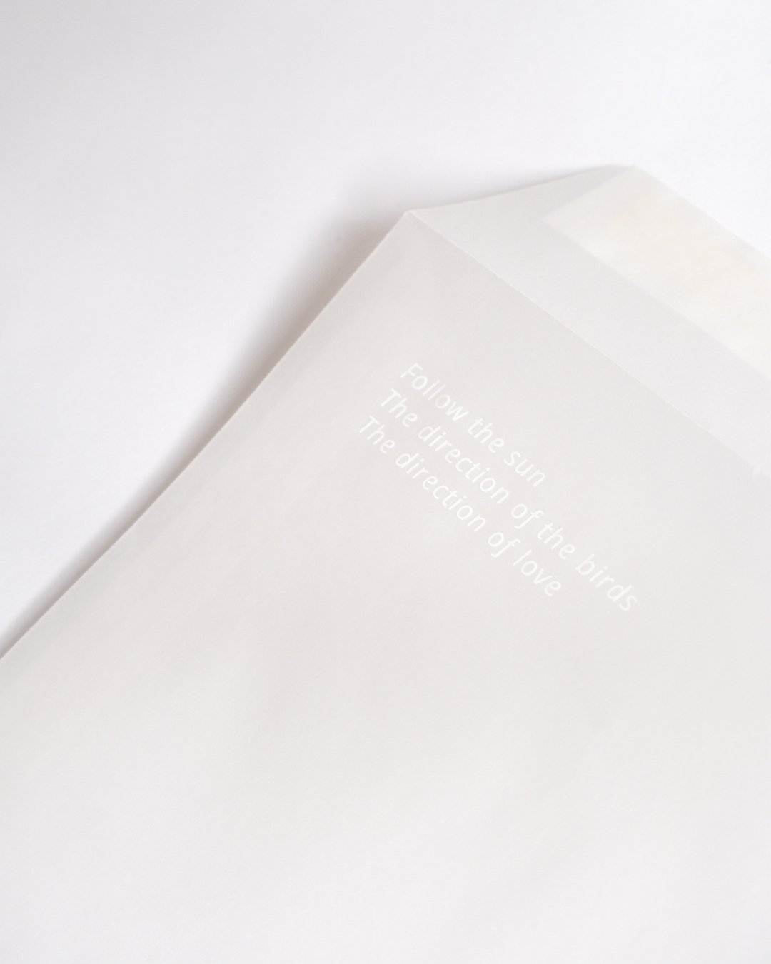 Architectural wedding stationery suite with folded elements and minimalist design.