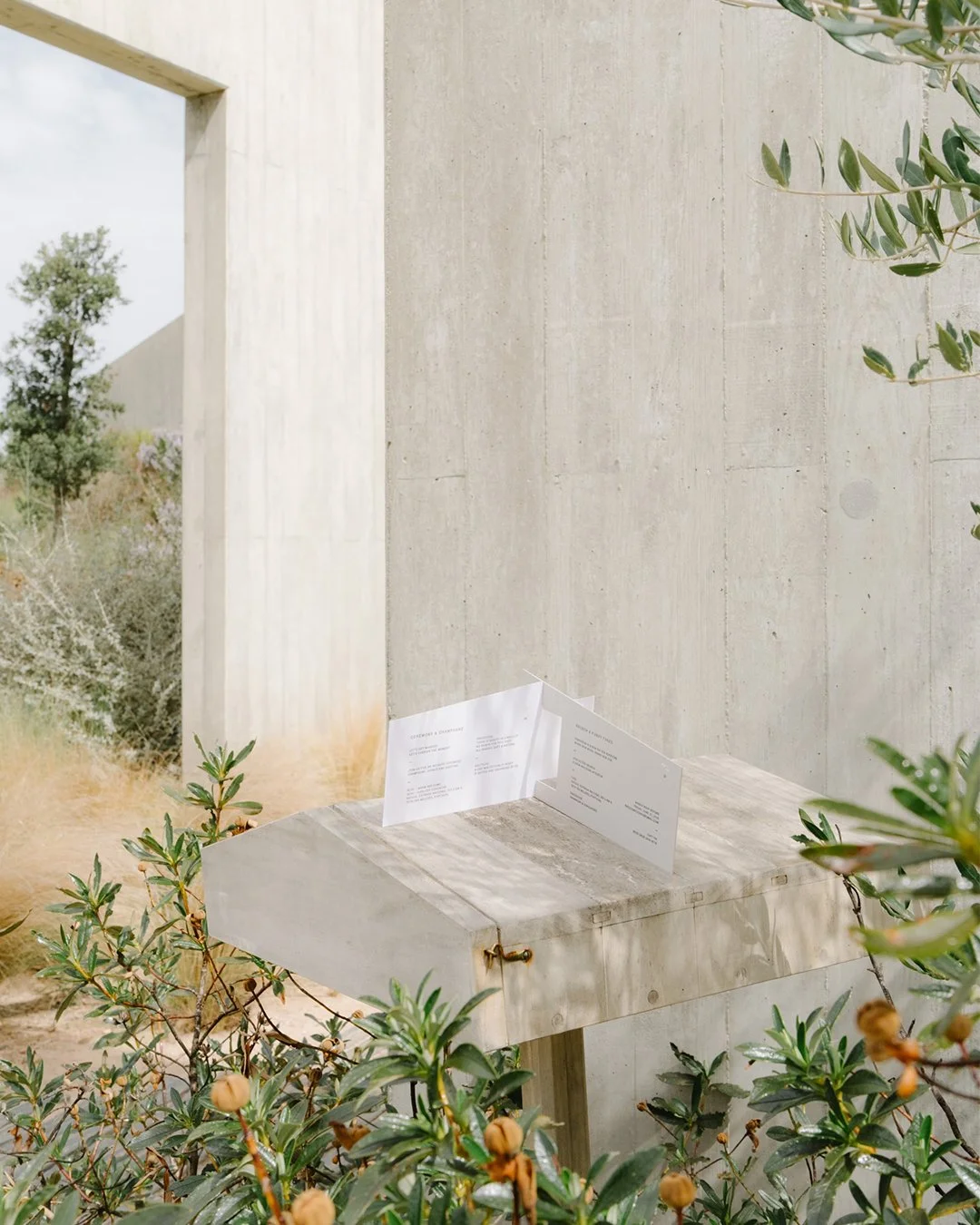 Architectural wedding stationery suite with folded elements and minimalist design.