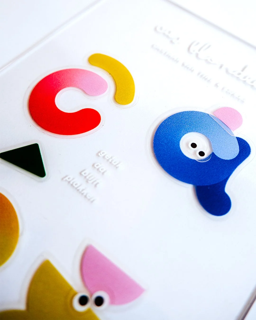 Transparent plexi birth announcement for Cas with reusable stickers allowing recipients to create playful compositions