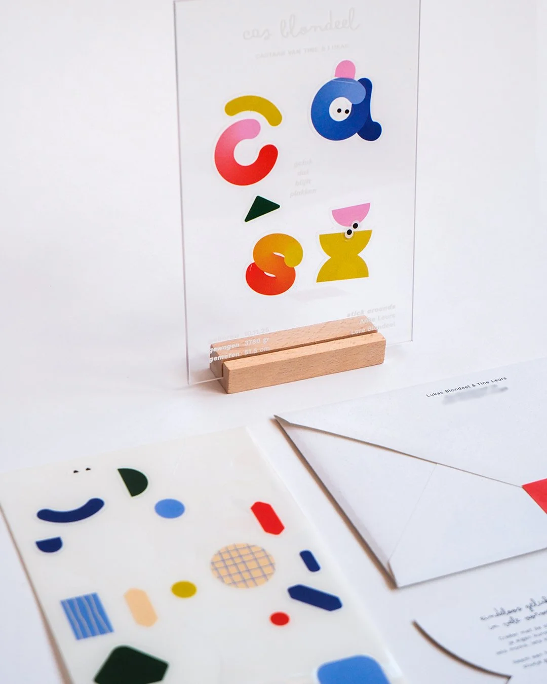 Transparent plexi birth announcement for Cas with reusable stickers allowing recipients to create playful compositions