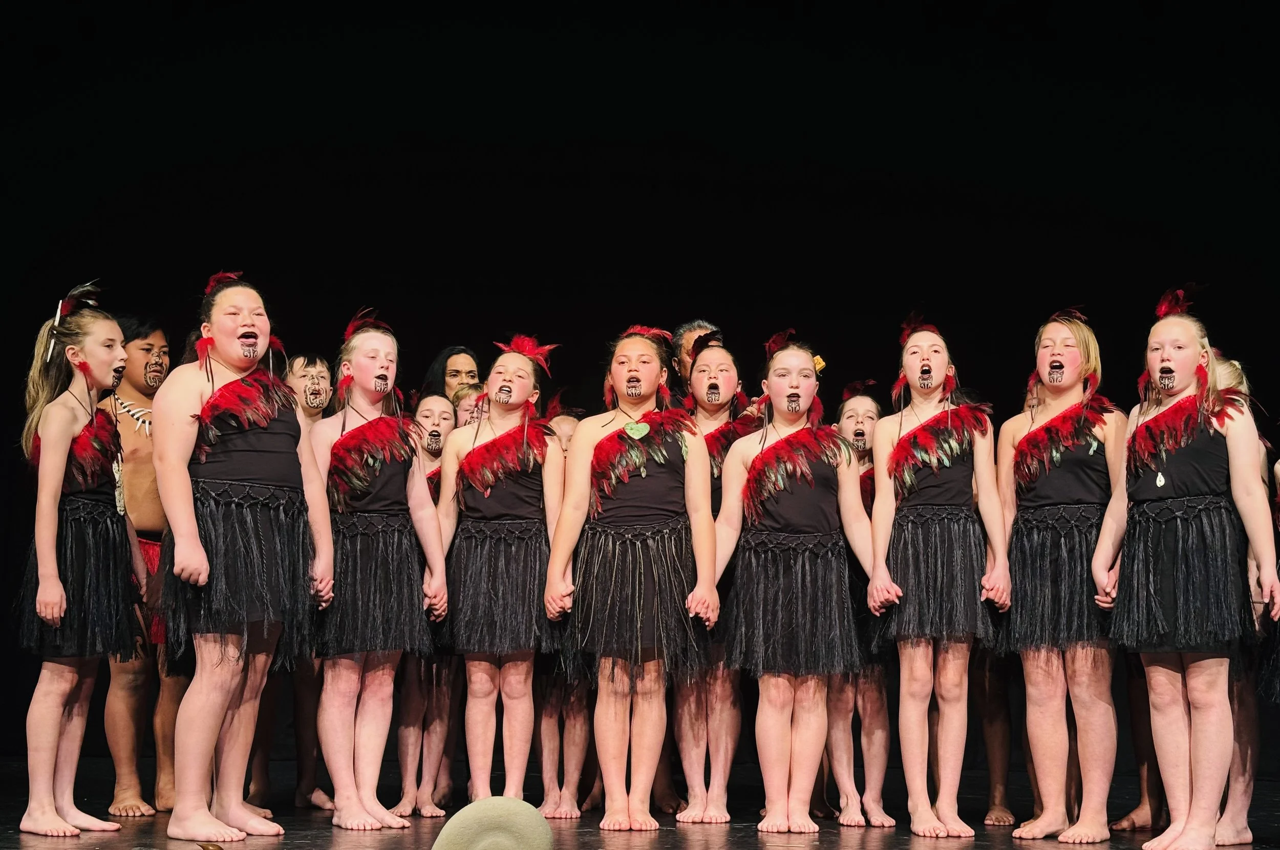 Rangatahi performing on stage in Musselburgh youth programme kapa haka performance