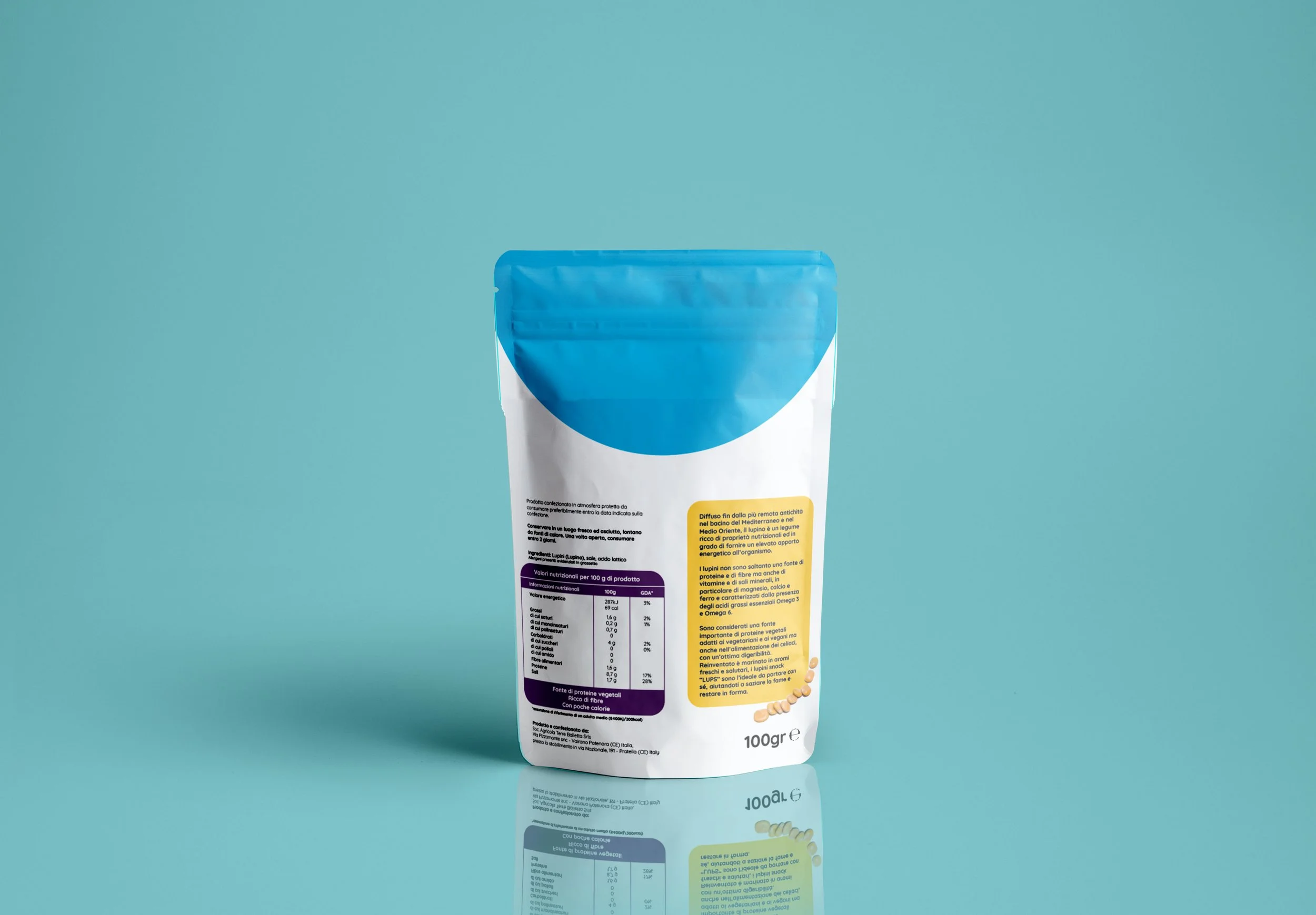 A stand-up pouch with a blue top and yellow label, featuring nutritional and product information, set against a turquoise background.