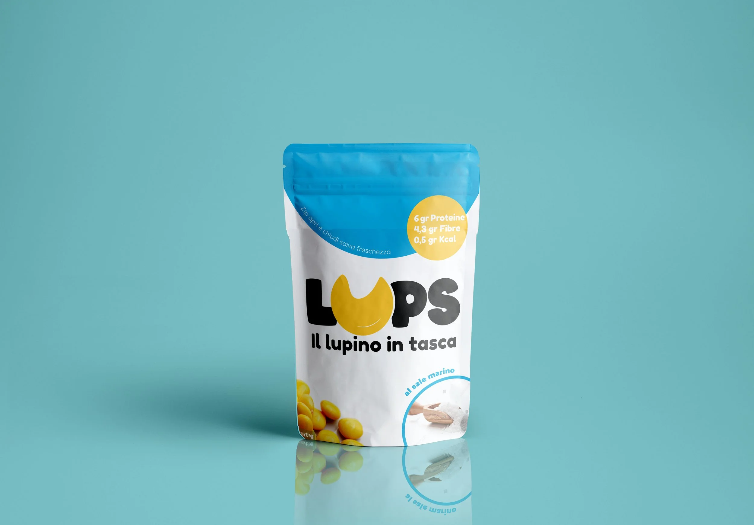 A white snack package with a blue top, yellow and black text, and an image of yellow beans, set against a teal background.