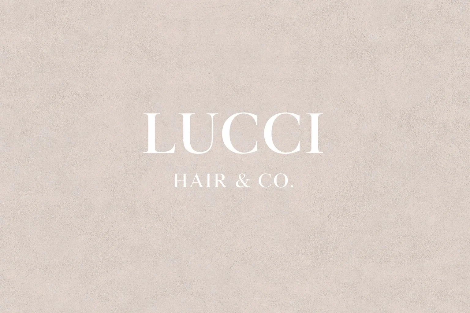Lucci Hair & Co. logo on a beige textured background.