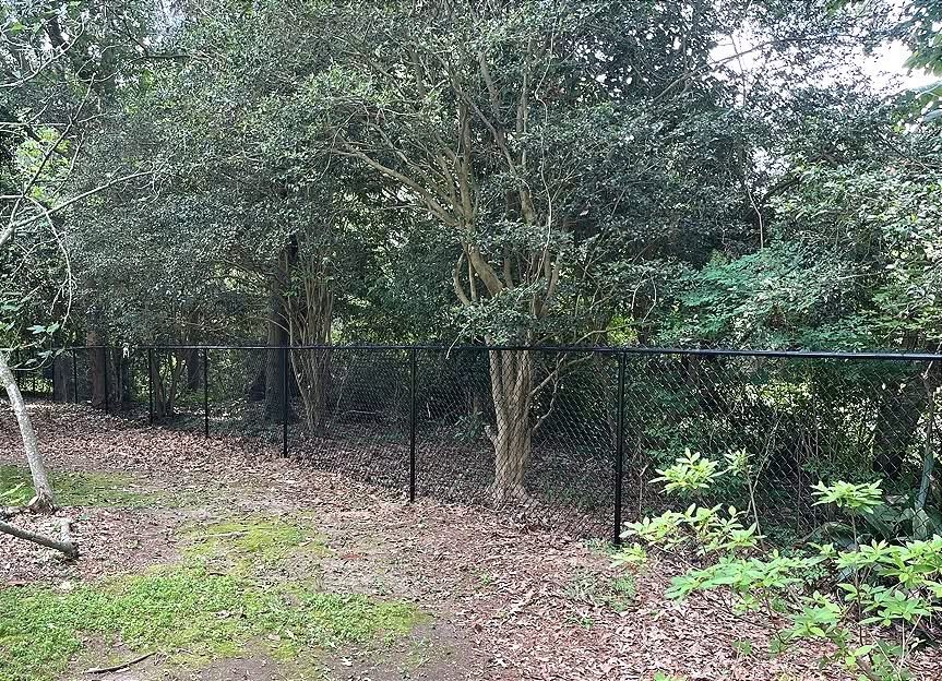 A black chain-link fence installed in Baton Rouge LA