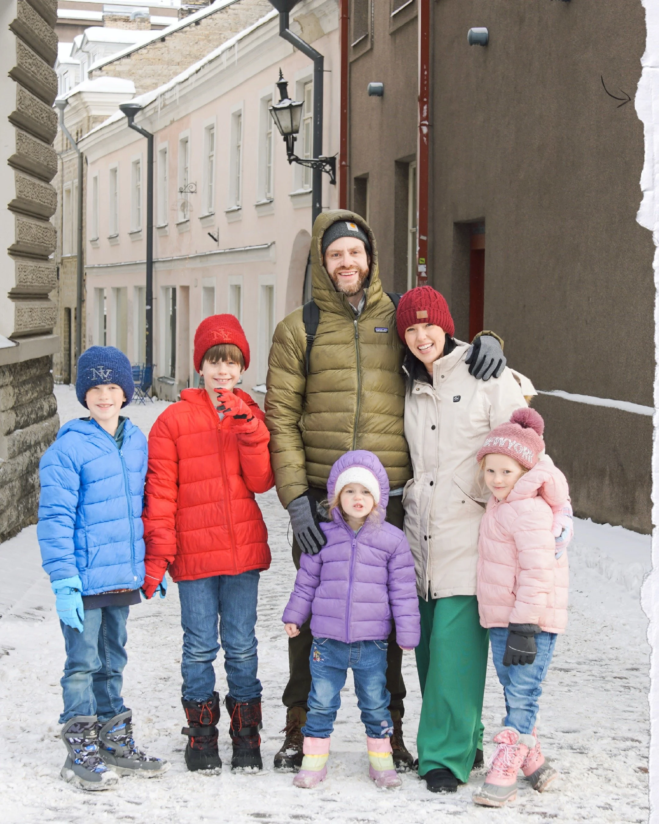 Tyler Tice, the Amelia Island and Fernandina Beach Painter, stands with his family posing for a family picture.