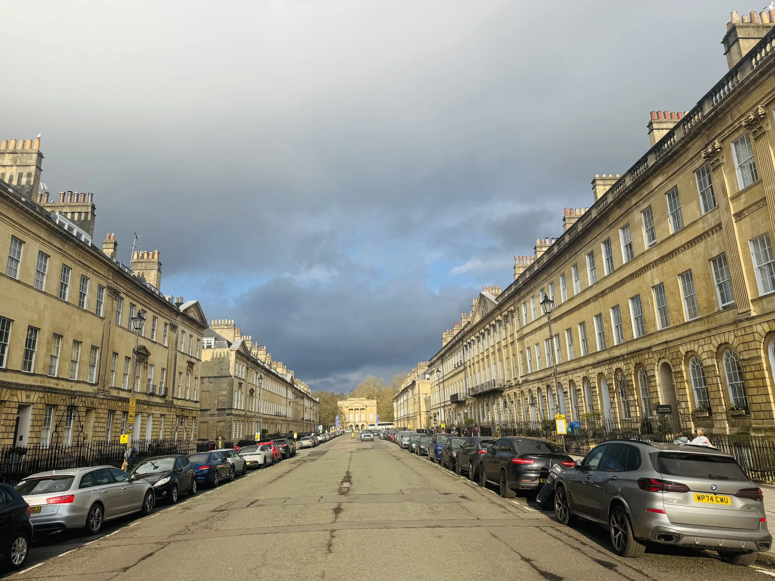 A street lined with Georgian style townhouses on both sides, and the Holbourne Museum in the distance.
