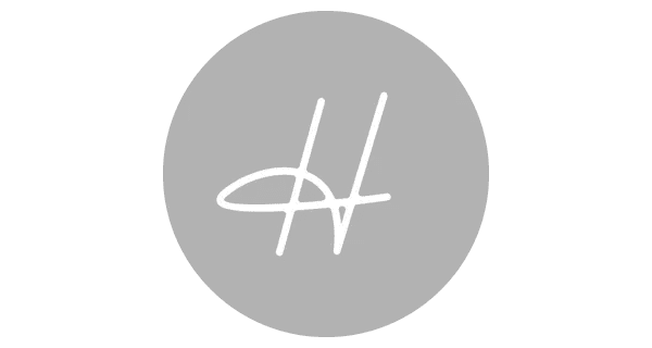 Gray circular logo with white stylized initials 'H' and 'V' overlapping