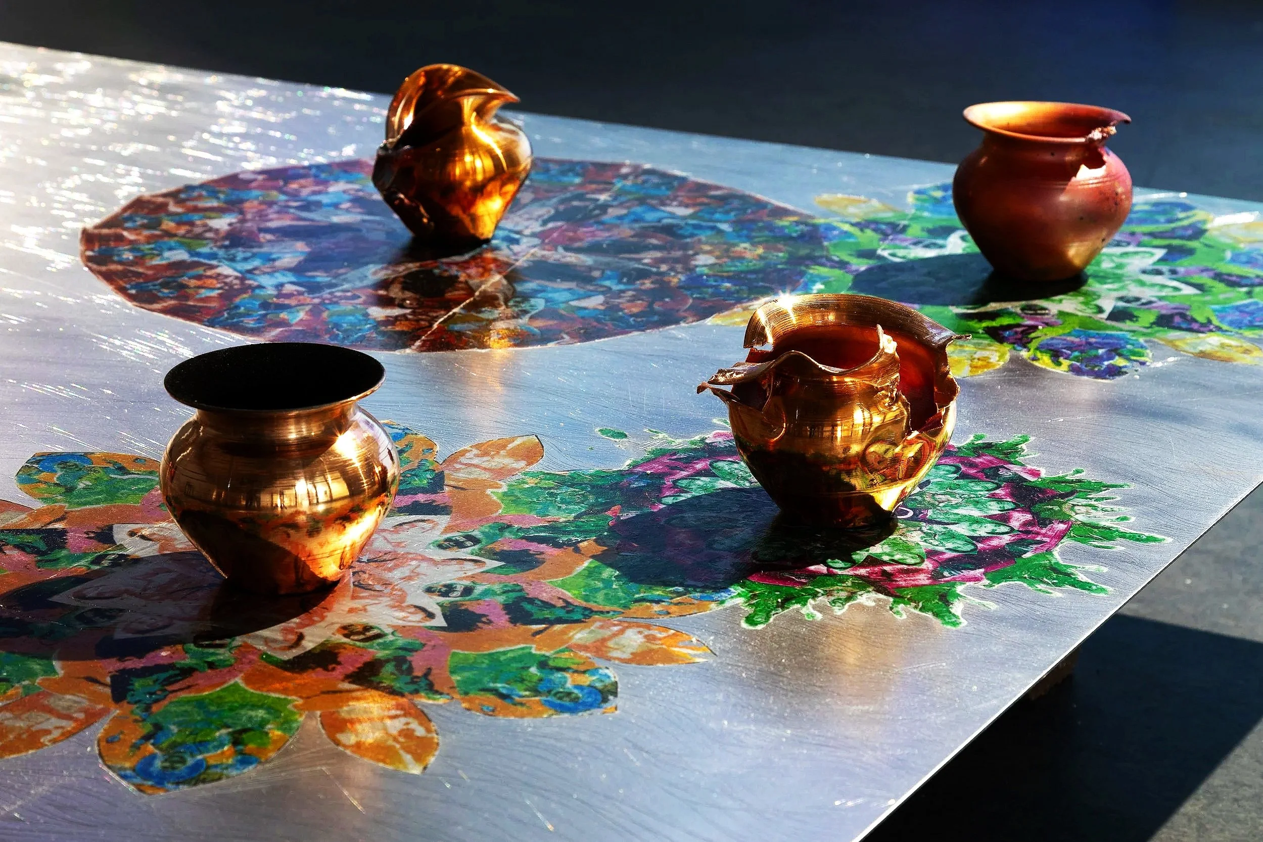 R Godbole 2024 Ganga: Instalation VIew - Detail lota pots, photo transfer mandalas & engraved steel plate