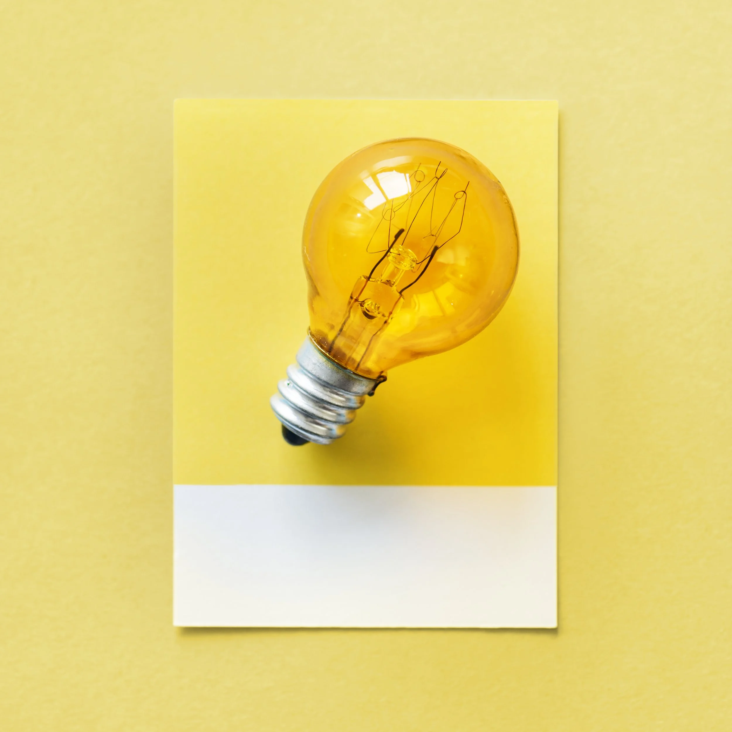 Light bulb concept symbolising brand strategy and clarity for wellness brands and coaches