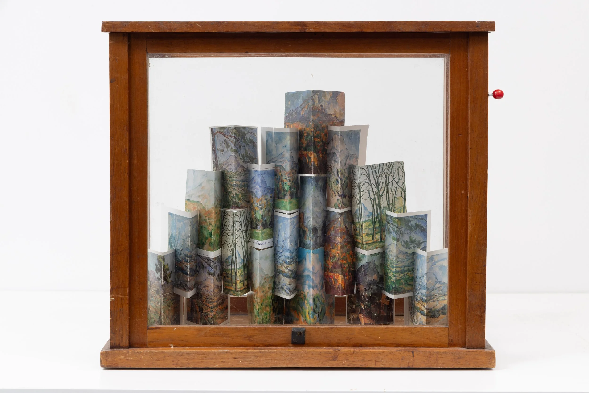 ‘Build me a mountain… (after Cézanne)’, postcards and vintage vitrine, 45 x 40 x 23 cm, 2025