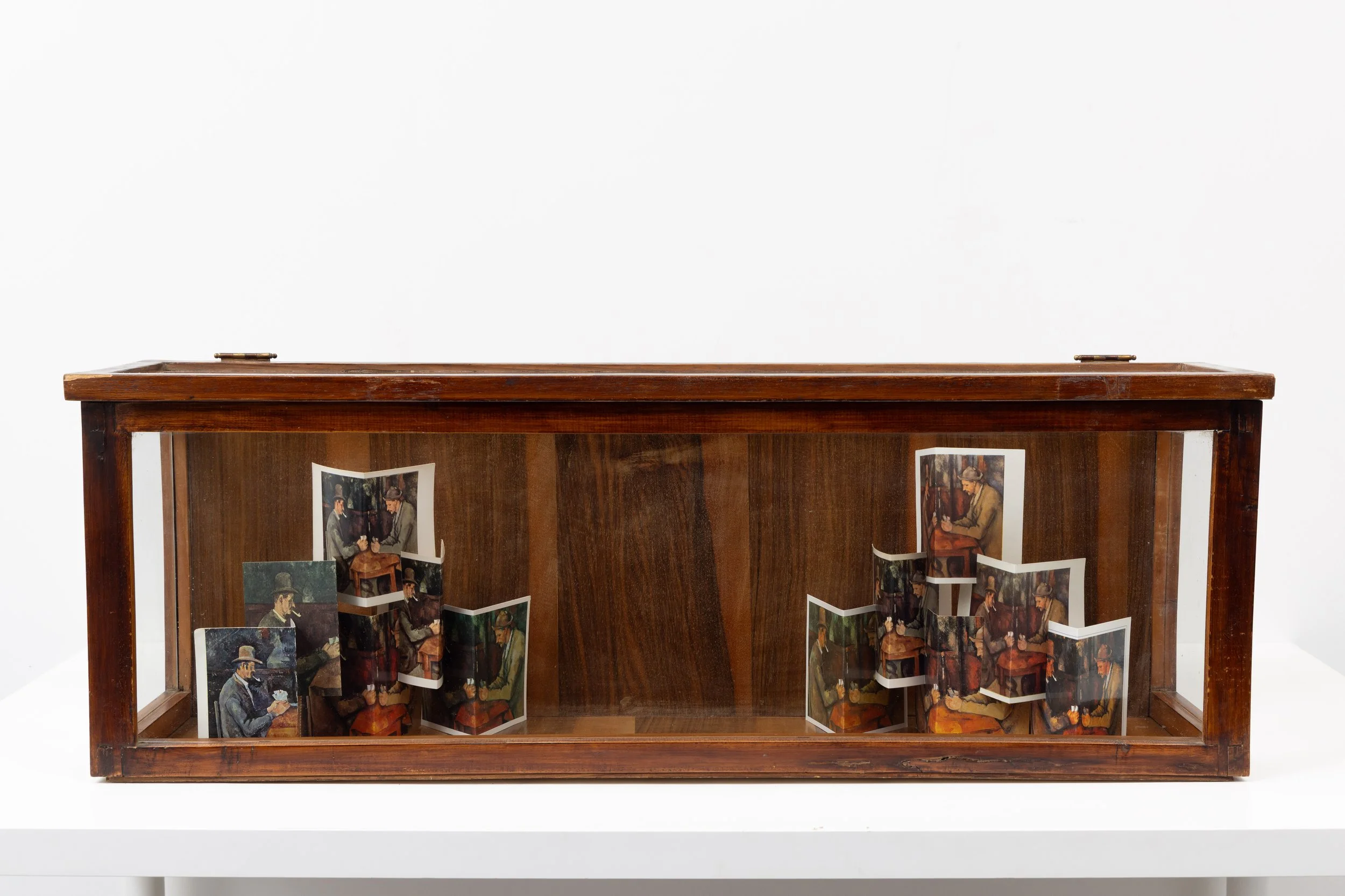‘Playing Cards, (after Cézanne)’, postcards and vintage vitrine, 86 x 30 x 21 cm, 2025
