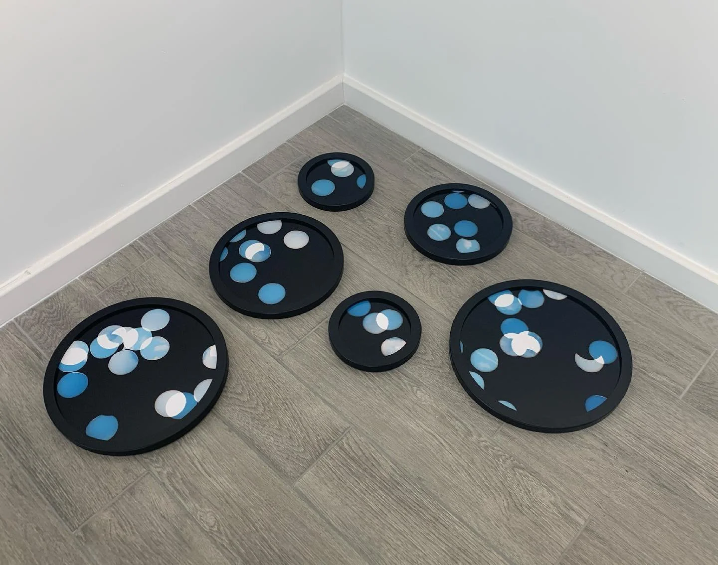 ‘Pieces of Sky', six circular framed unique photographs from negative confetti,  18.5 cm, 24cm,  29cm, 34 cm diameter, 2020