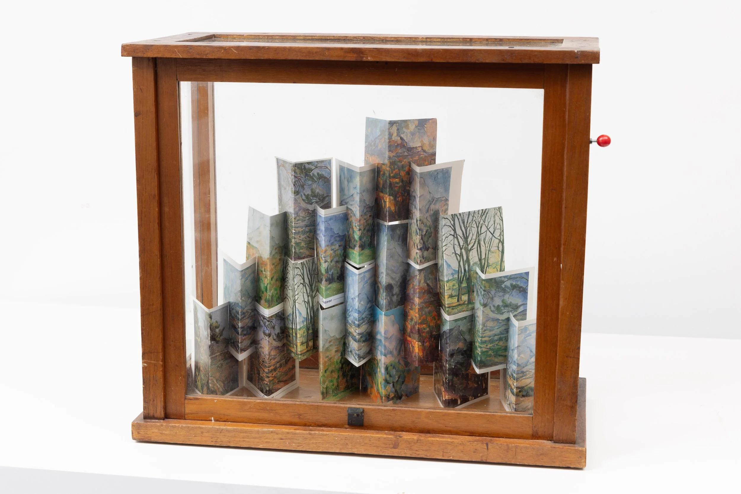 ‘Build me a mountain… (after Cézanne)’, postcards and vintage vitrine, 45 x 40 x 23 cm, 2025