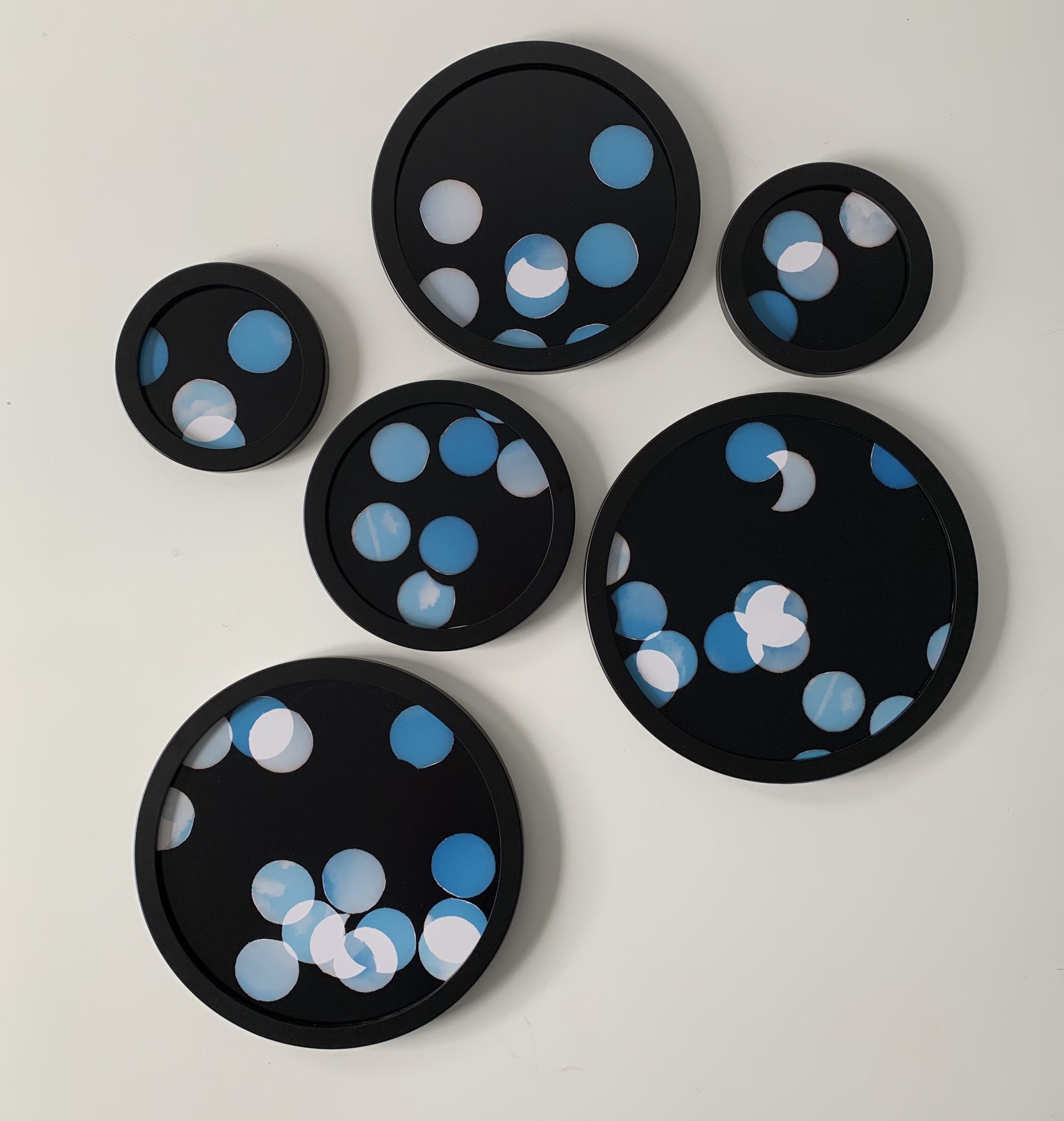 ‘Pieces of Sky', six circular framed unique photographs from negative confetti,  18.5 cm, 24cm,  29cm, 34 cm diameter, 2020