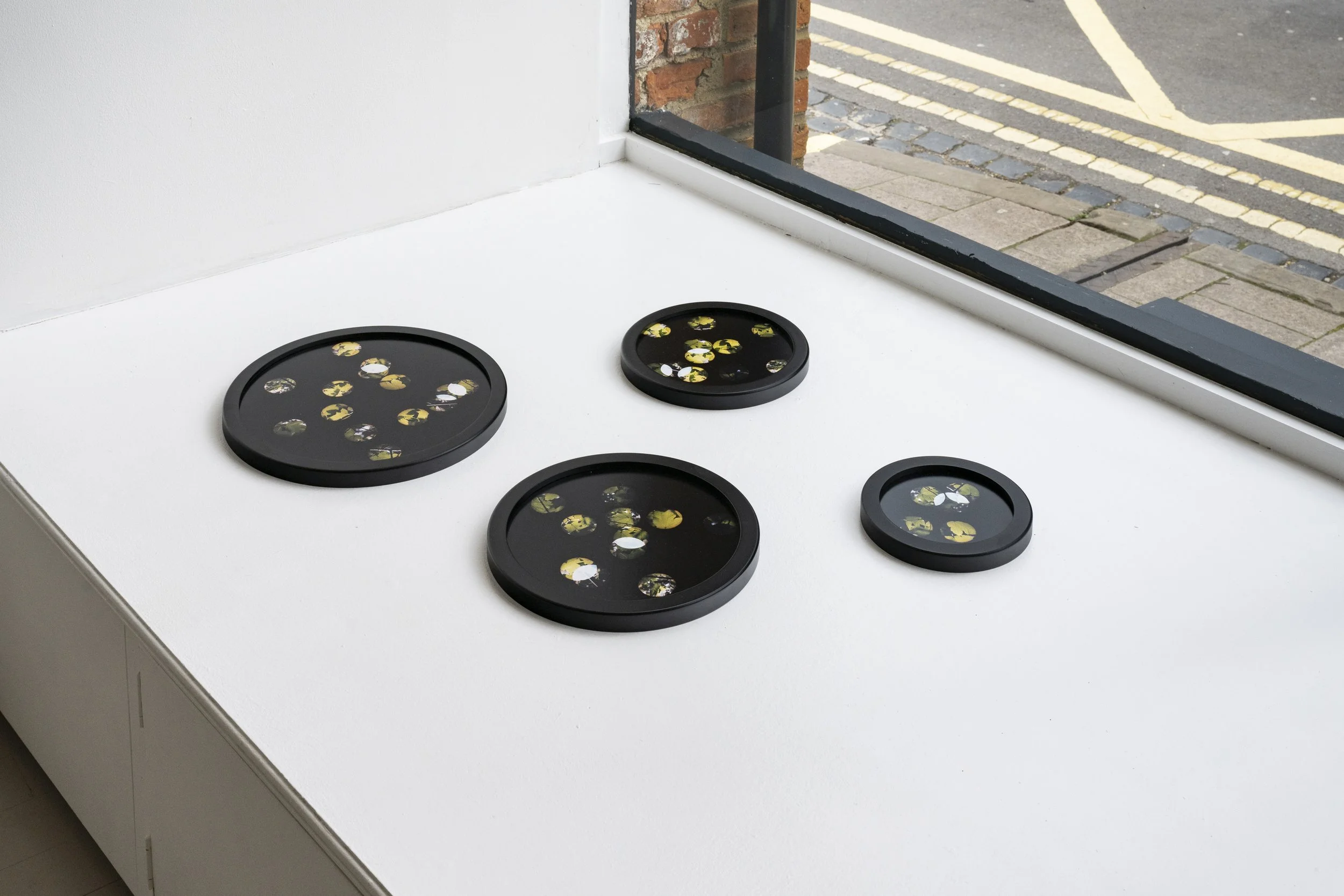 ‘Entre’acte’, circular framed unique photographs from negative confetti, 18.5 cm, 24cm,  29cm, 34 cm diameter, 2022