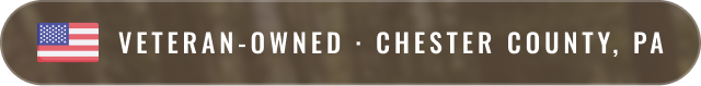 Banner with a small American flag icon and text reading "Veteran-Owned, Chester County, PA"