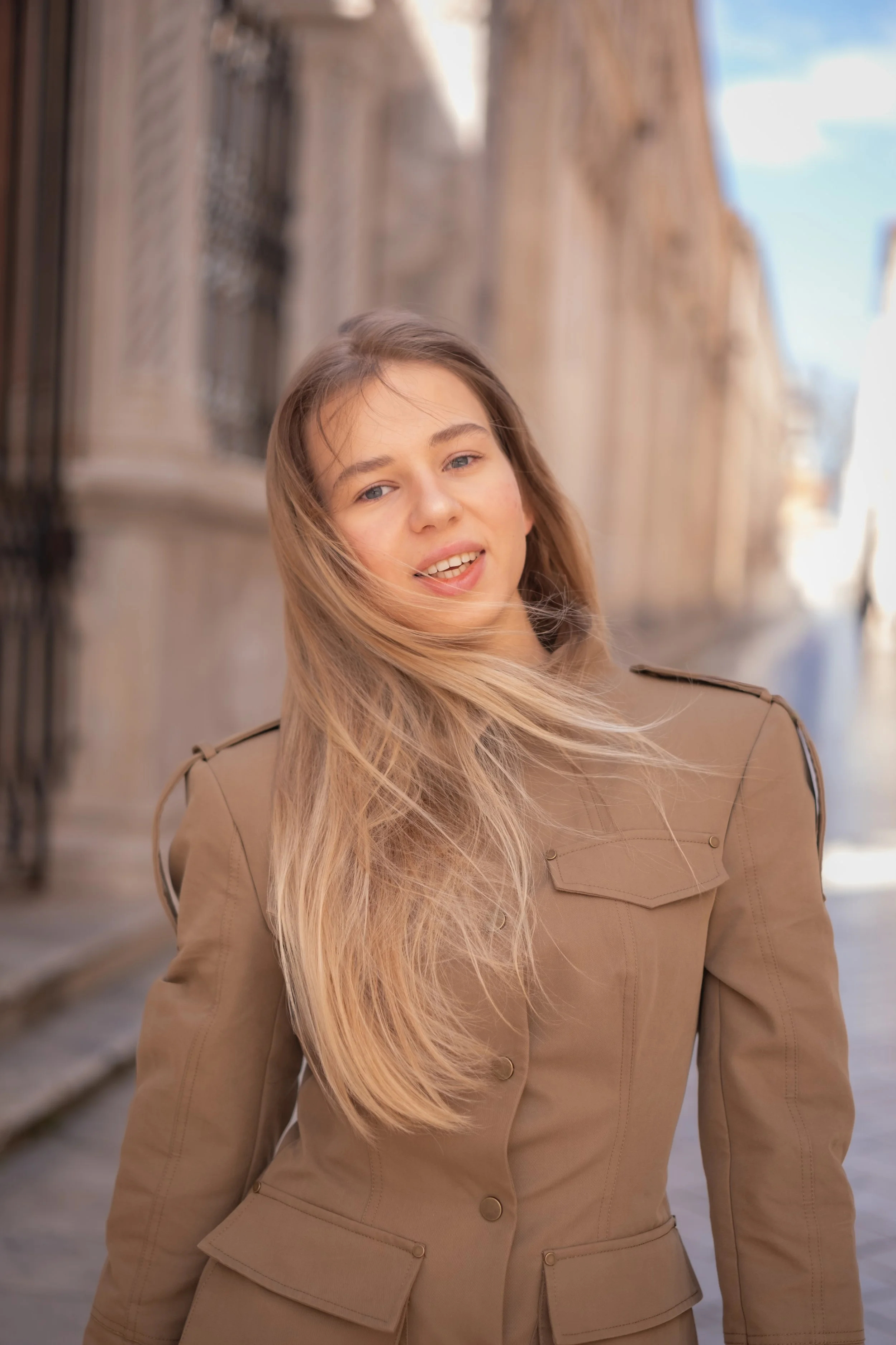 A soft and natural portrait session in a European old town. Wind, light, and genuine эмоции create elegant and timeless travel portraits. Ideal for personal travel memories and lifestyle photography.