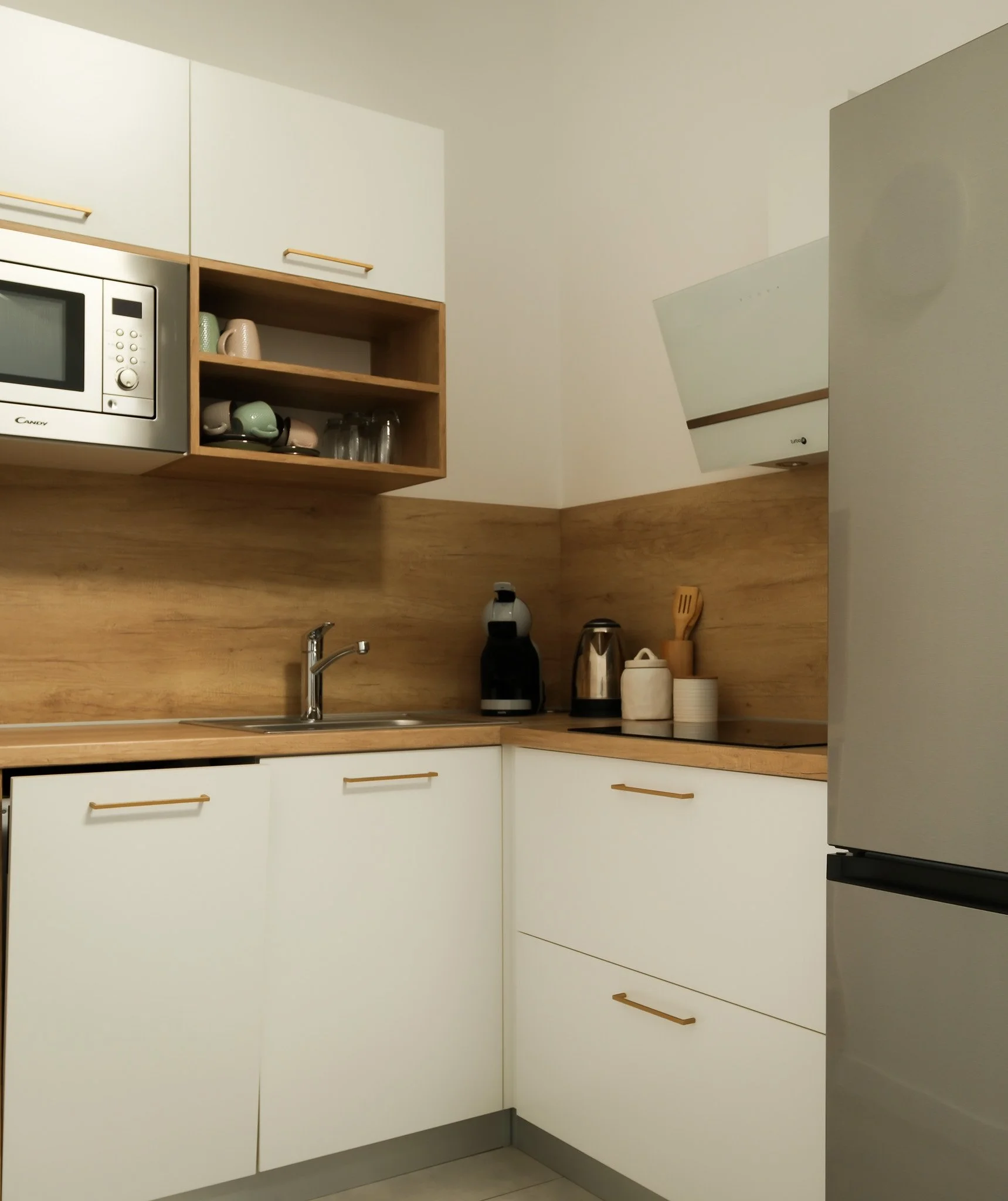 Modern boutique hotel kitchen with white cabinetry