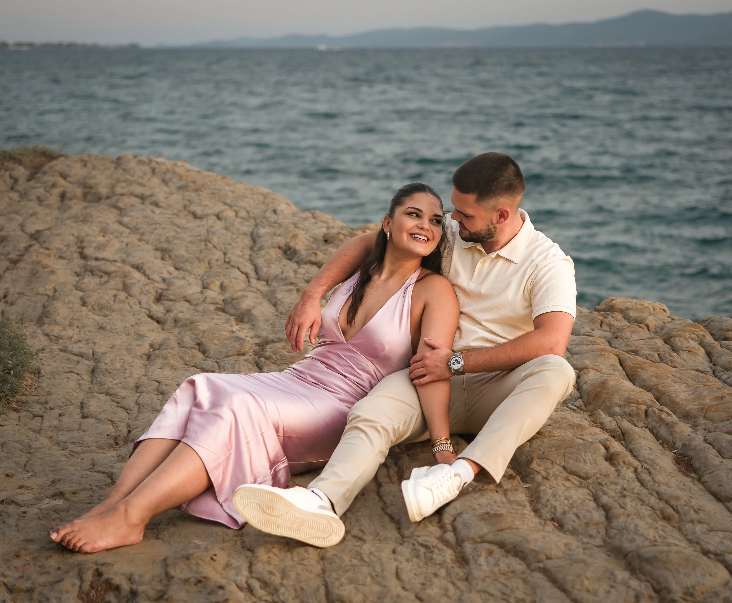 Romantic couple at emotional moments photoshoot in Zadar, Croatia at sunset by the sea with natural light and emotional moments