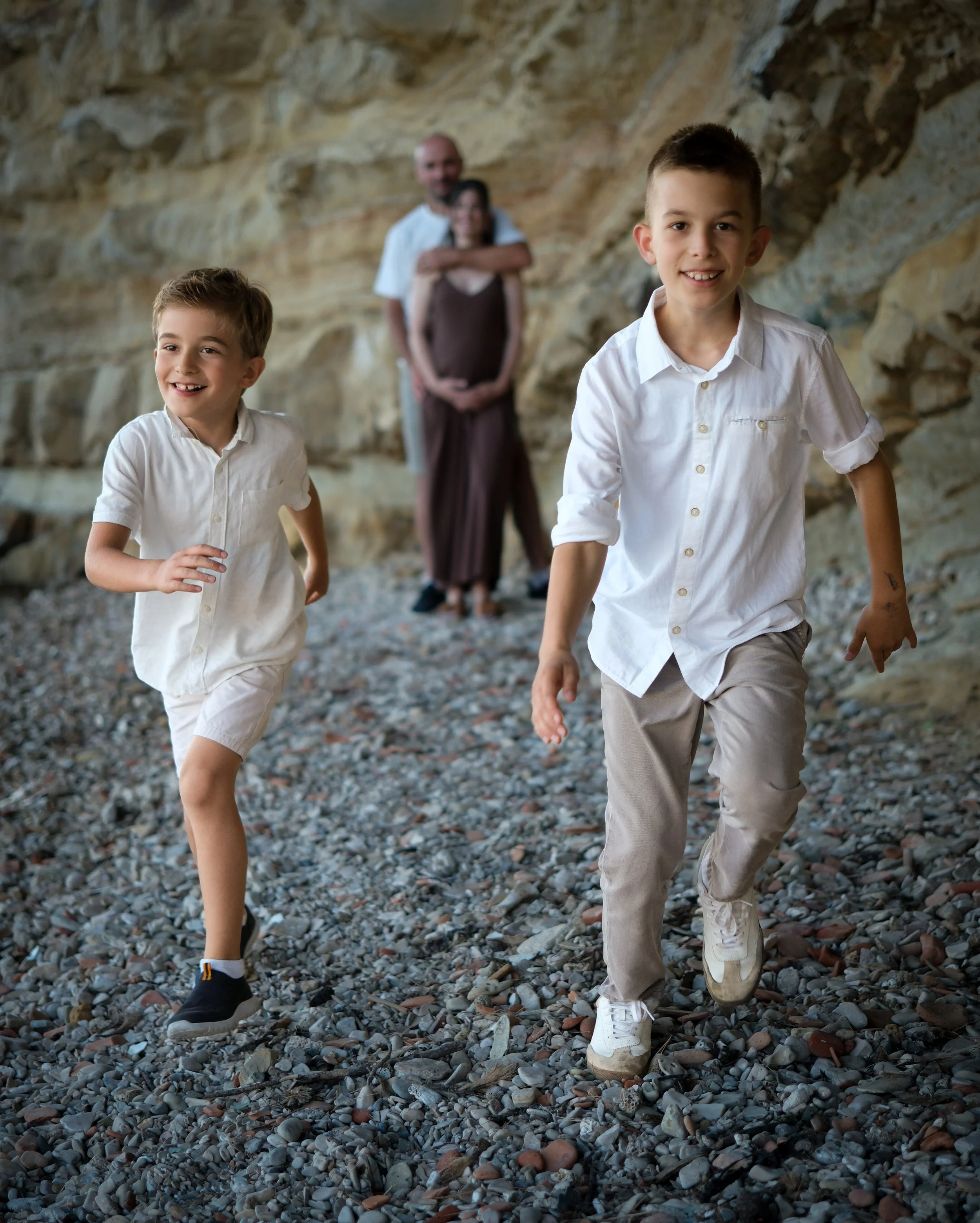 children playing on the beach during a family photoshoot in Zadar