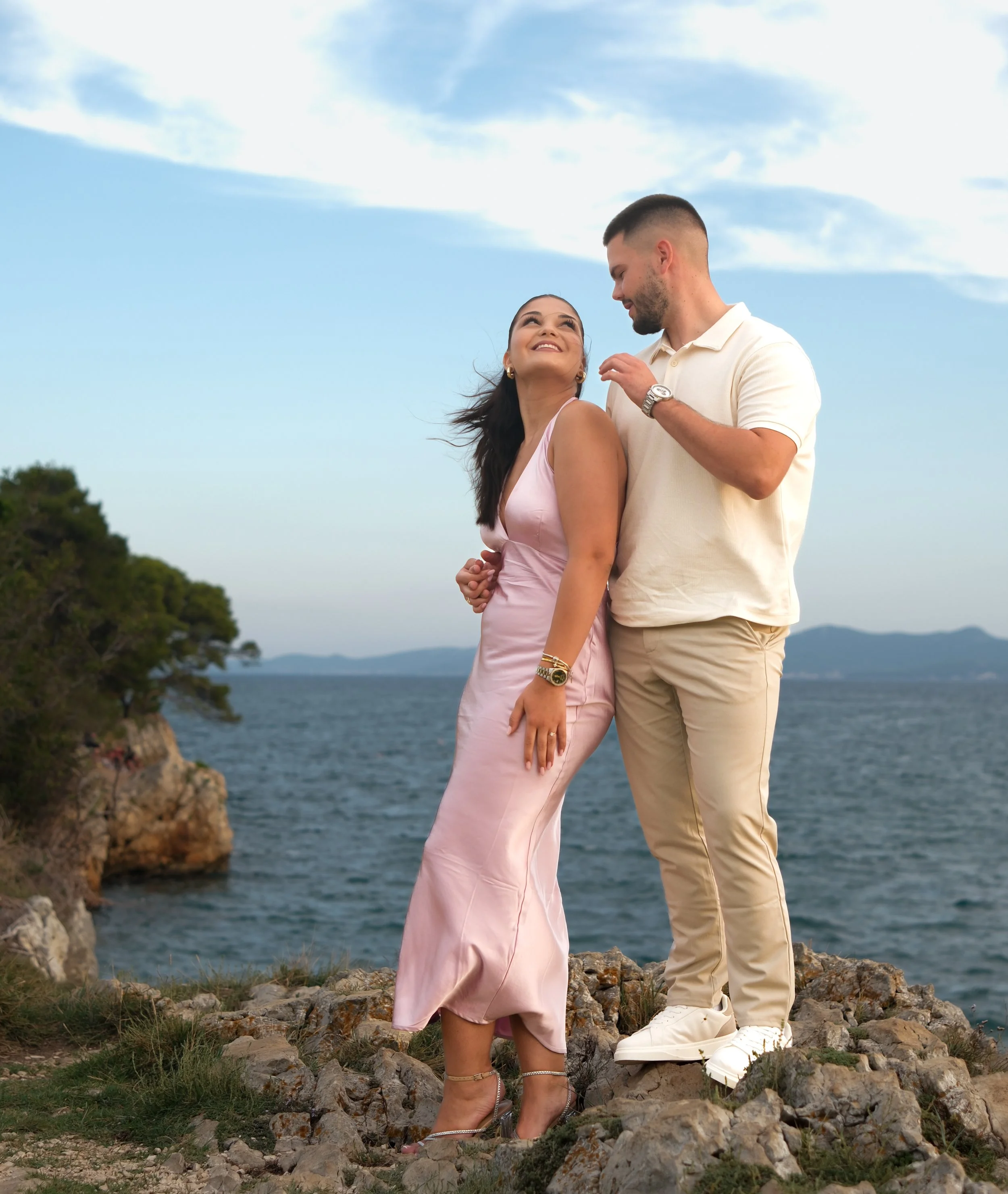 Romantic couple photoshoot at cliffs in Zadar, Croatia at sunset by the sea with natural light and emotional moments