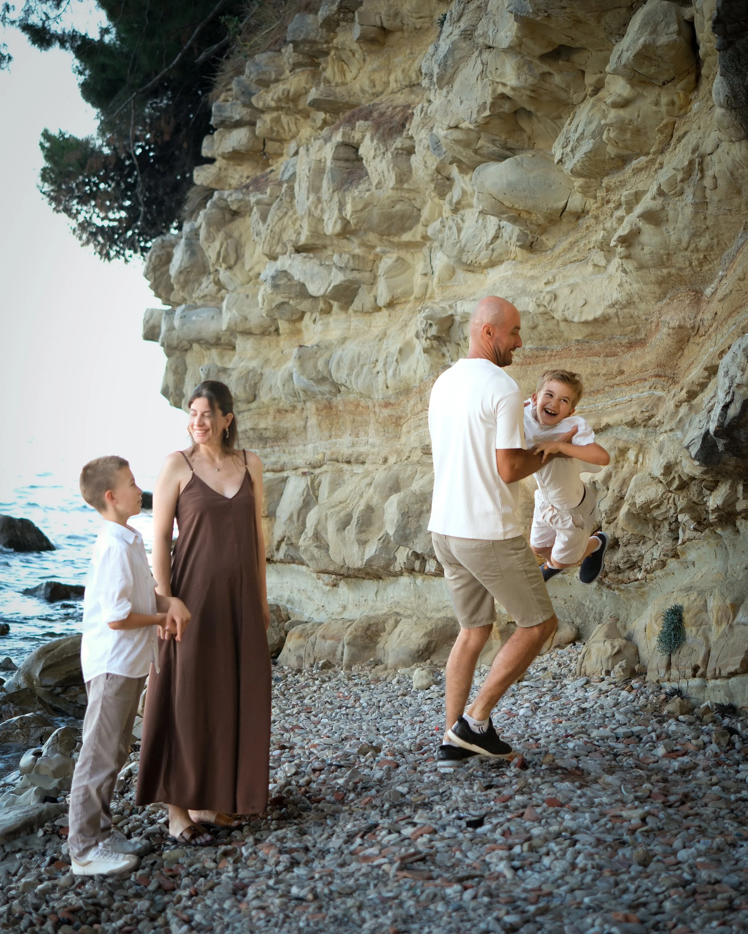 emotional moments with children  during a sunset family session Zadar