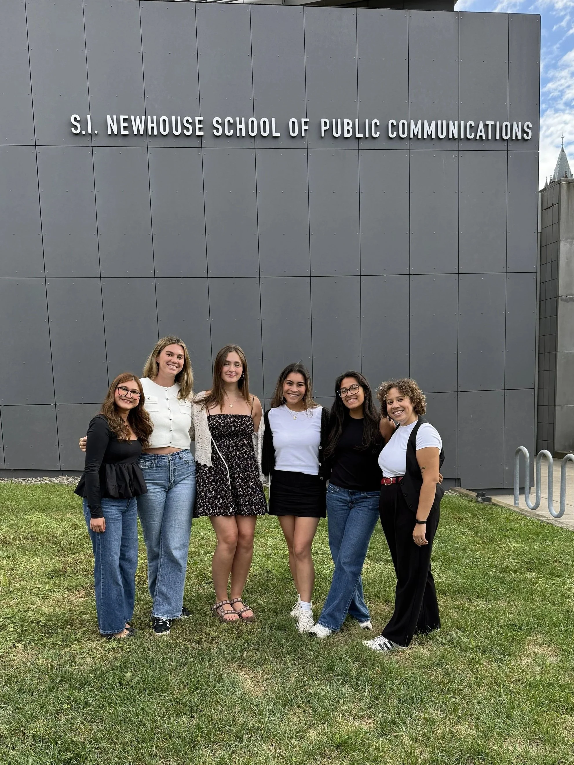 Cadence Dudley and peers in front of S. I. Newhouse School of Public Communications.
